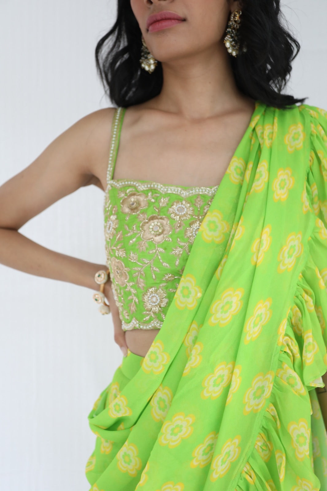 Lime green pre stitched ruffle sari with a hand embroidered blouse