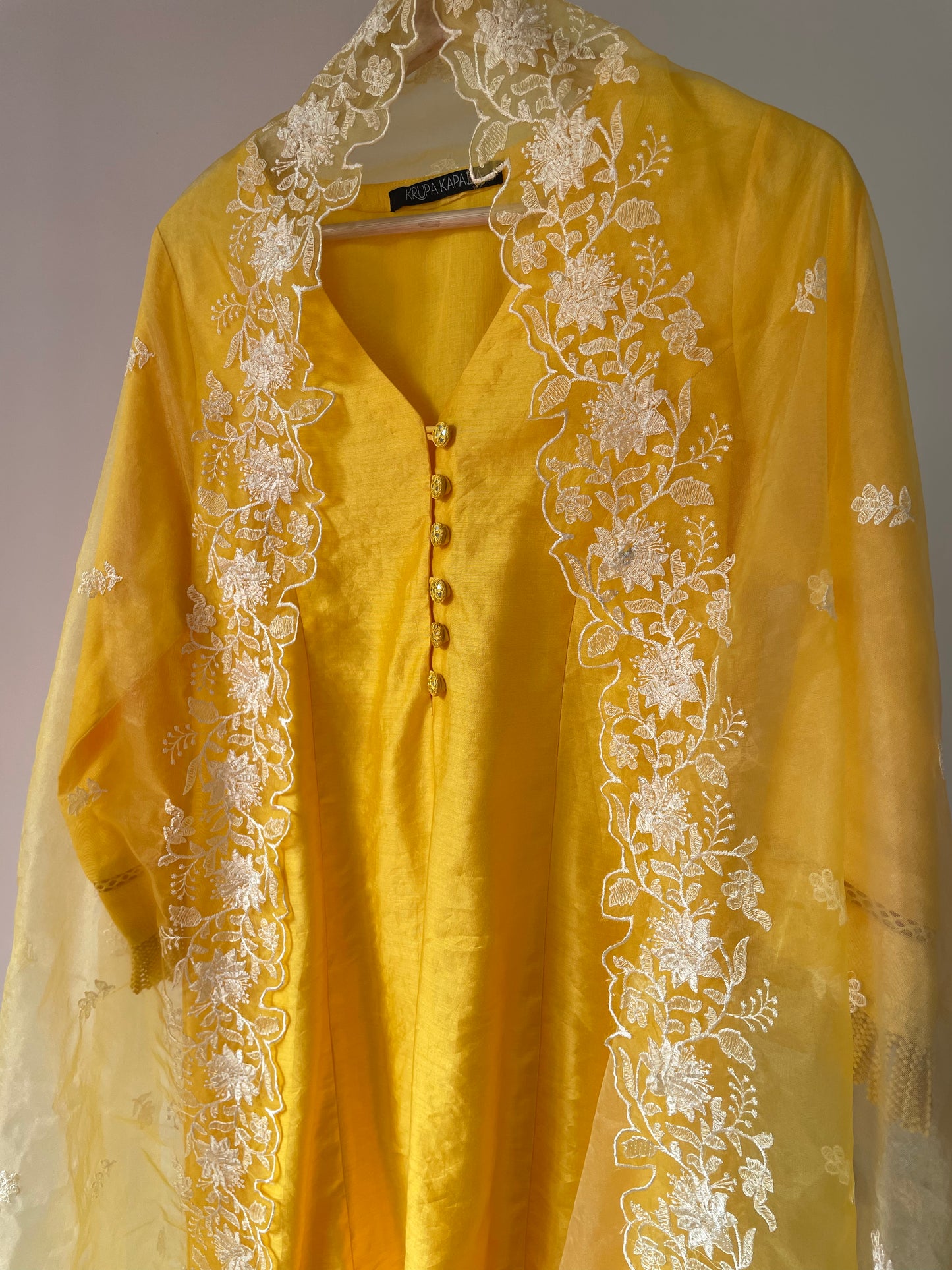 Sunny yellow chanderi kurta set with intricate detailing and an ombré dyed organza dupatta