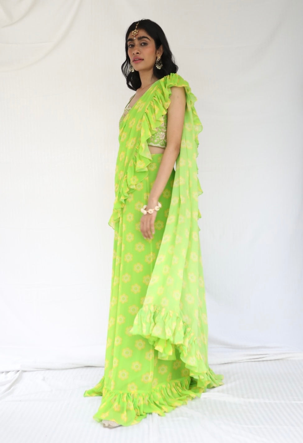 Lime green pre stitched ruffle sari with a hand embroidered blouse