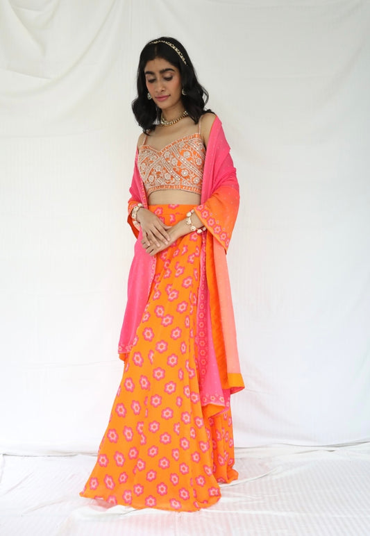 Orange lehenga with a hand embroidered blouse and a floral printed ombre dupatta