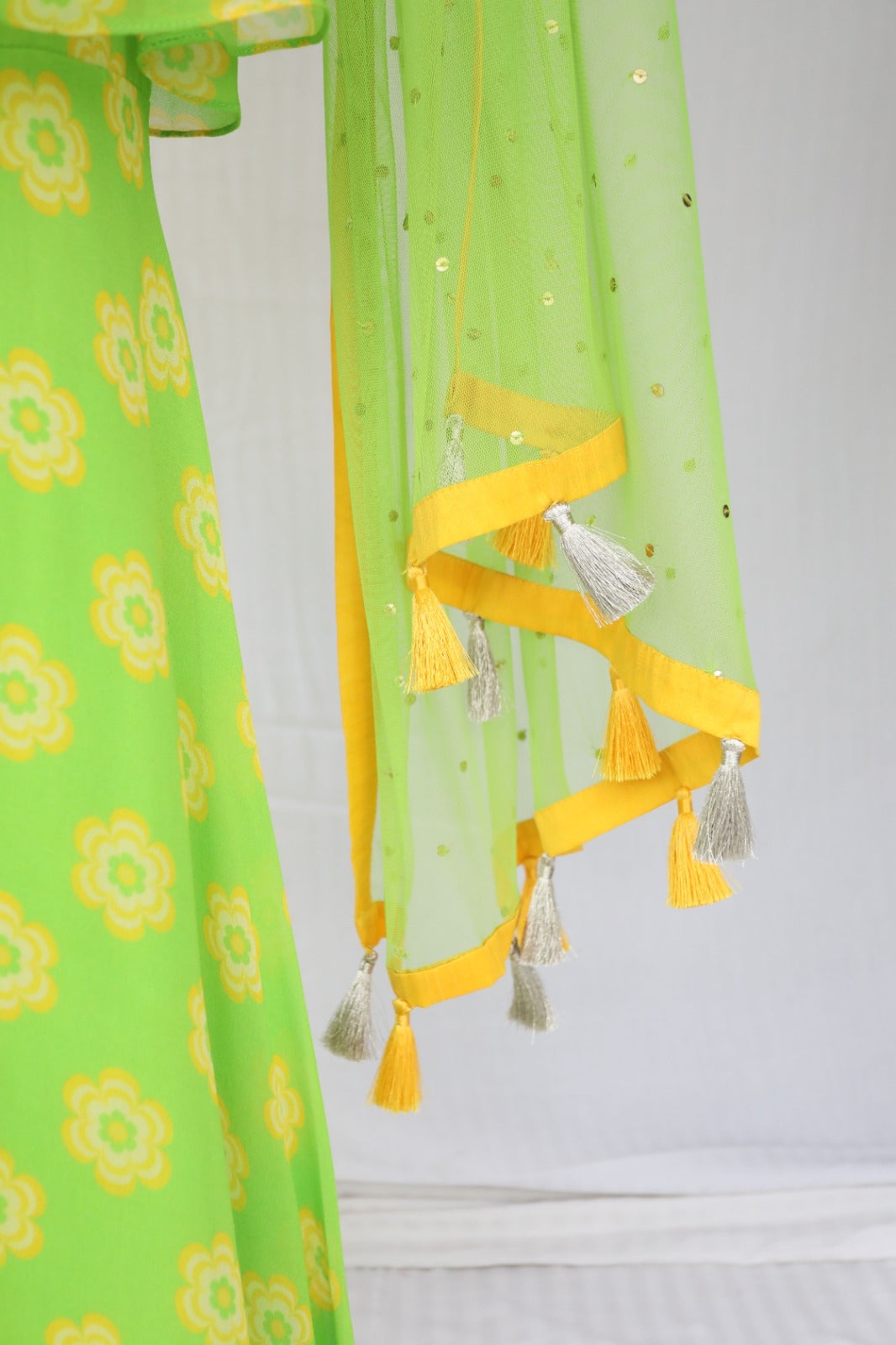 Green yellow floral printed sharara set with a hand embroidered neckline and dupatta