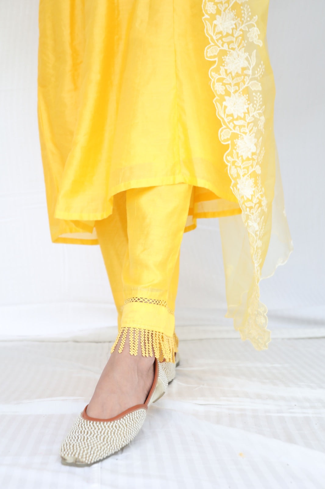 Sunny yellow chanderi kurta set with intricate detailing and an ombré dyed organza dupatta