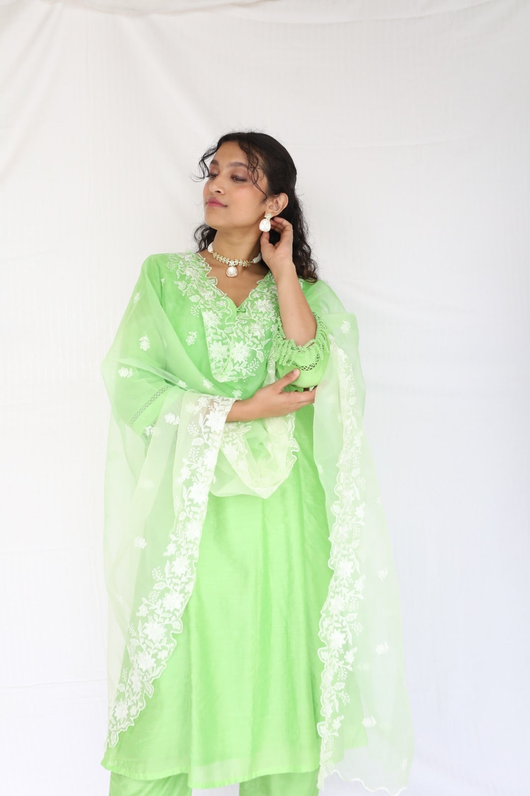 Mint green chanderi kurta set with intricate lace and shell detailing with an ombré dyed organza cutwork dupatta