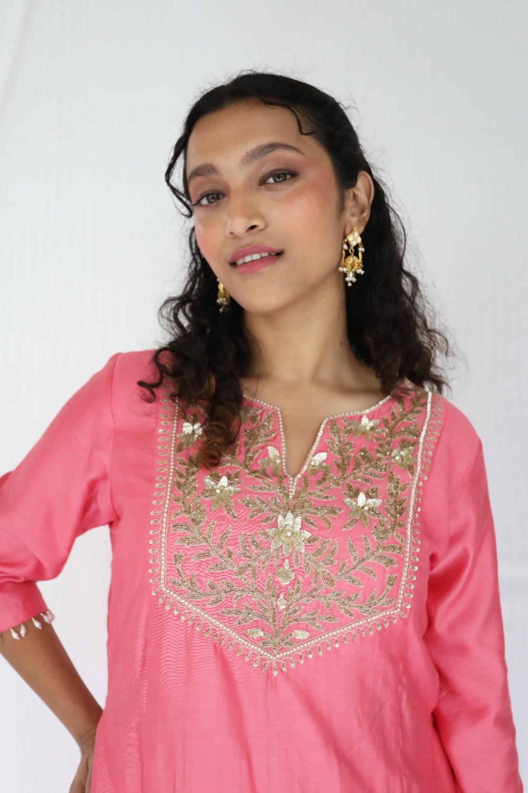 Peachy pink kurta set with a hand embroidered yoke and handwoven dupatta