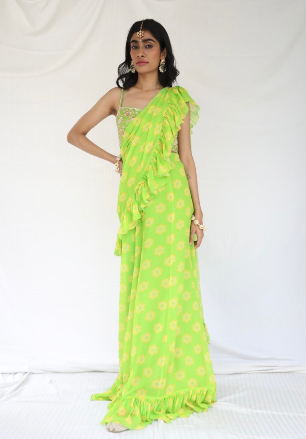 Lime green pre stitched ruffle sari with a hand embroidered blouse