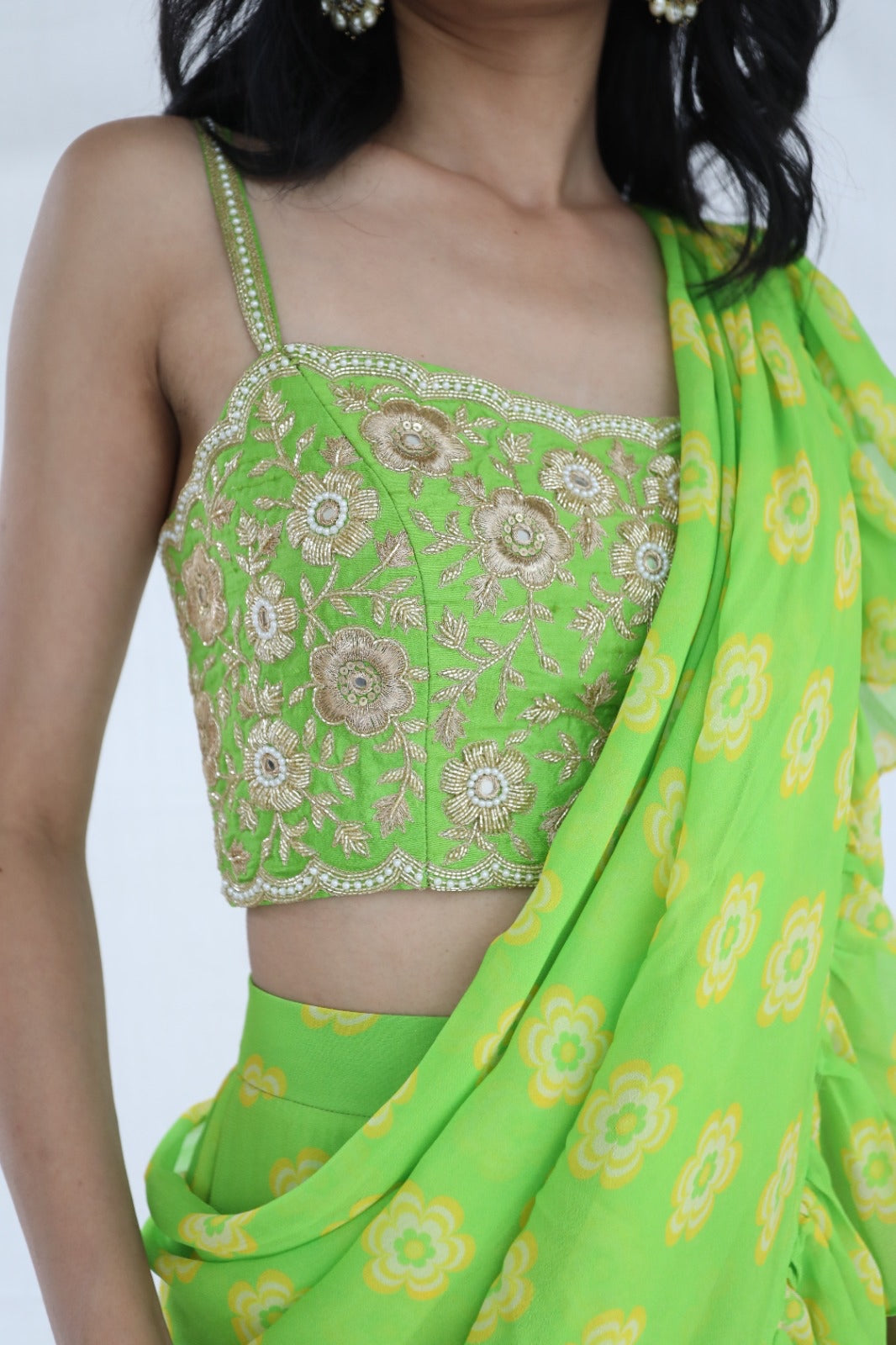 Lime green pre stitched ruffle sari with a hand embroidered blouse