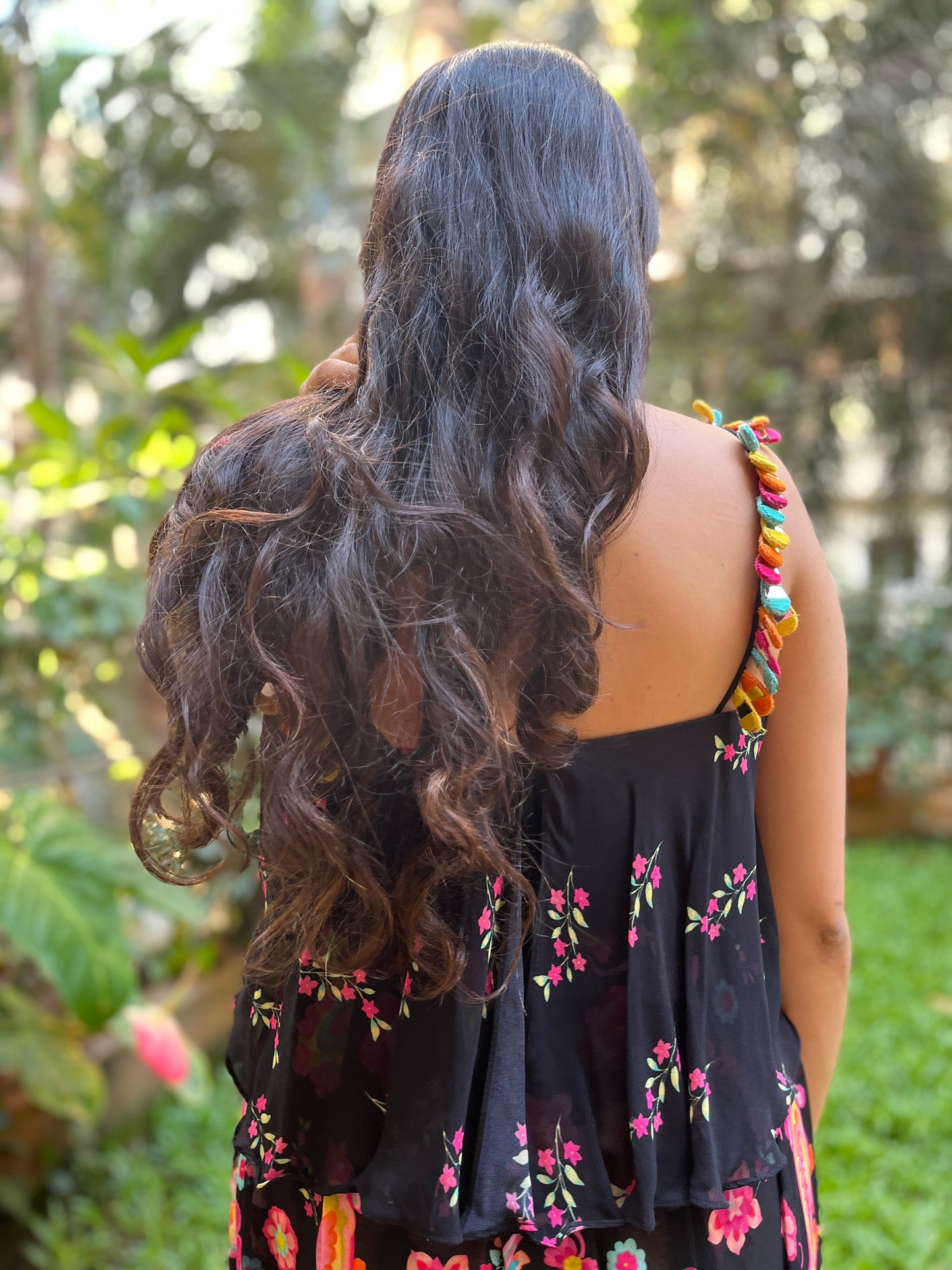 Black floral printed cami with colorful mirror work detailing with paisley printed high waisted palazzo pants