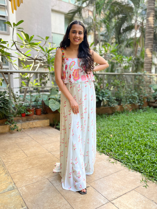 Ice blue paisley printed cami with colourful mirror work detailing and high waisted floral printed palazzo pants