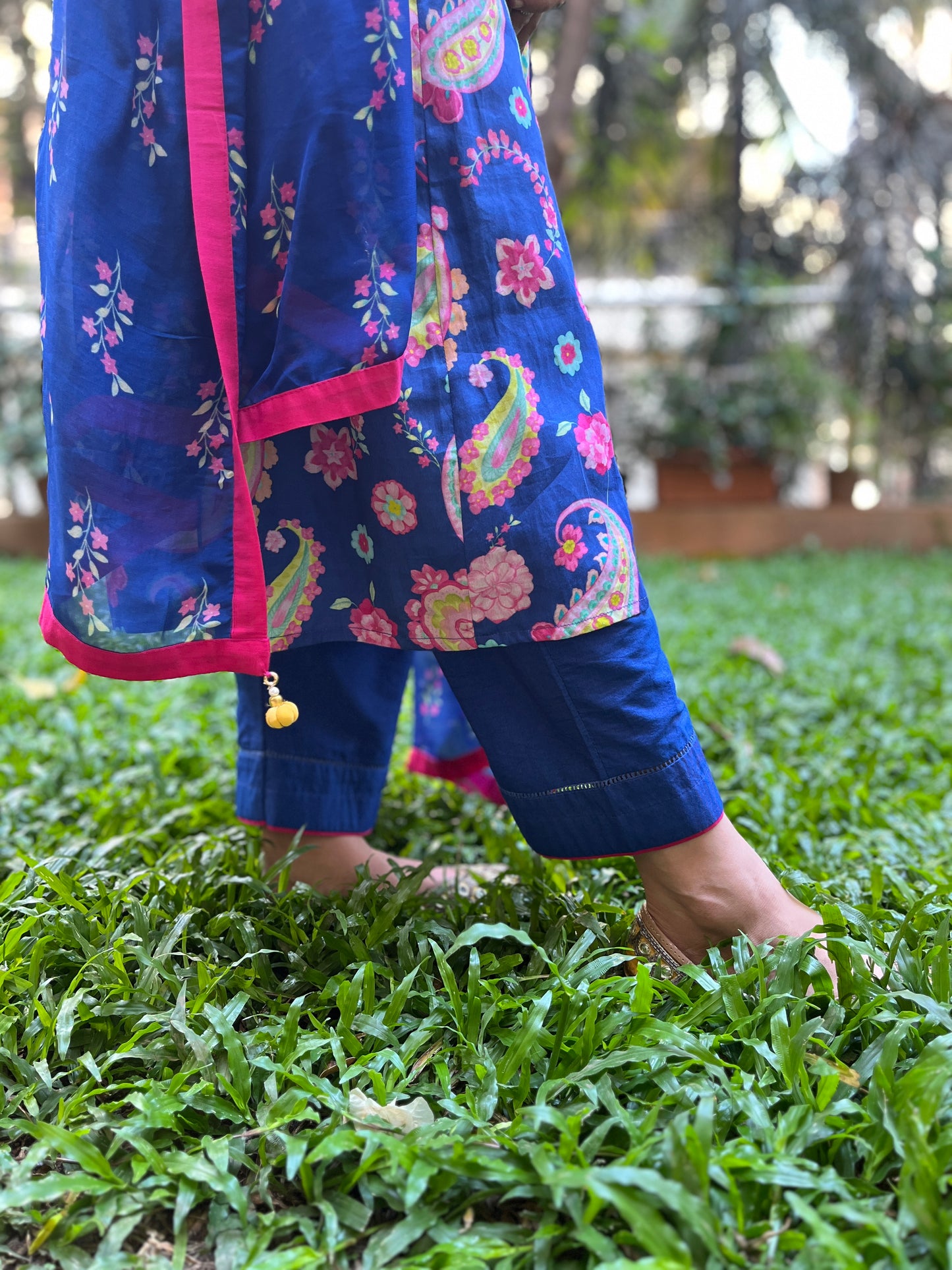 Navy blue paisley printed kurta with gold coin detailing, floral printed organza dupatta and pyjama pants