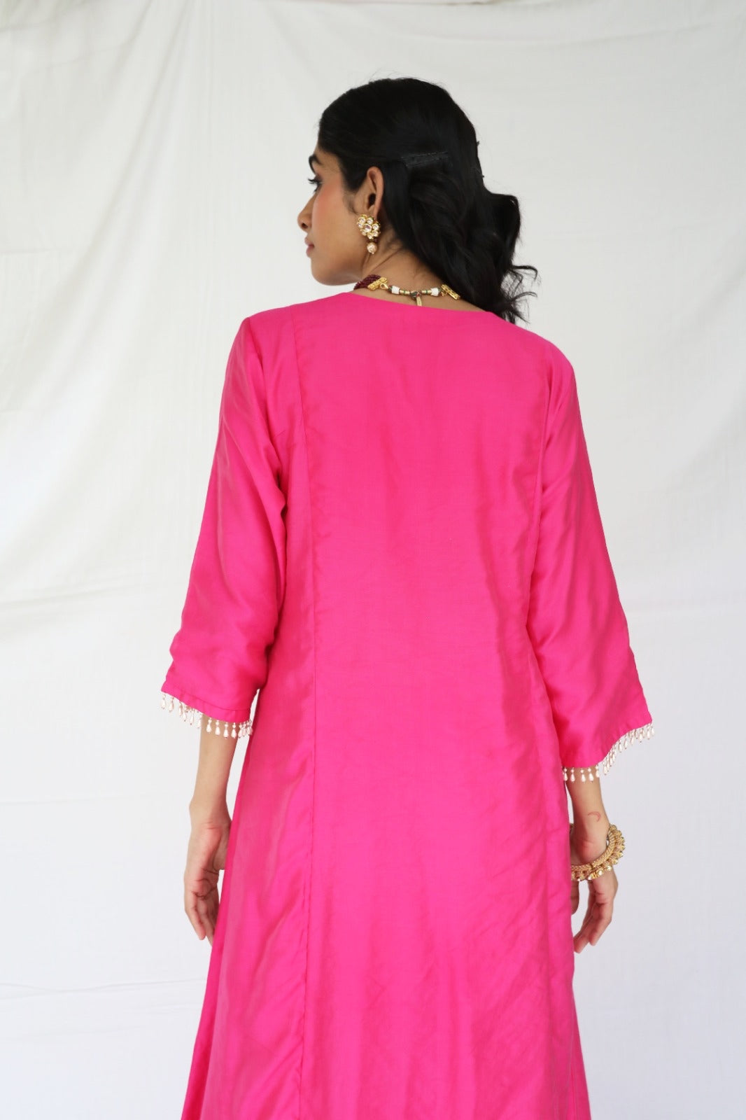 Rani pink chanderi kurta set with a hand embroidered yoke and handwoven dupatta