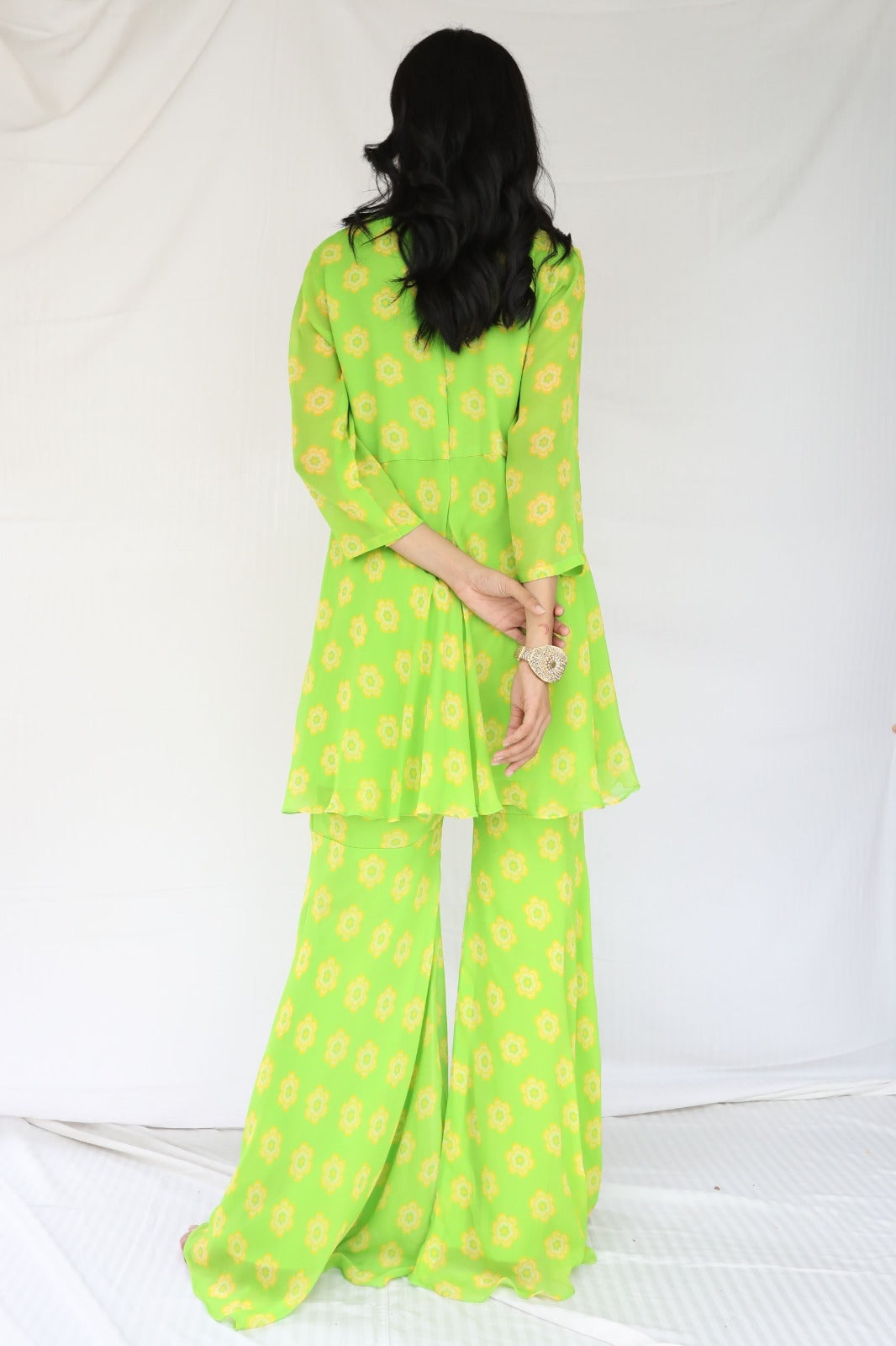 Green yellow floral printed sharara set with a hand embroidered neckline and dupatta