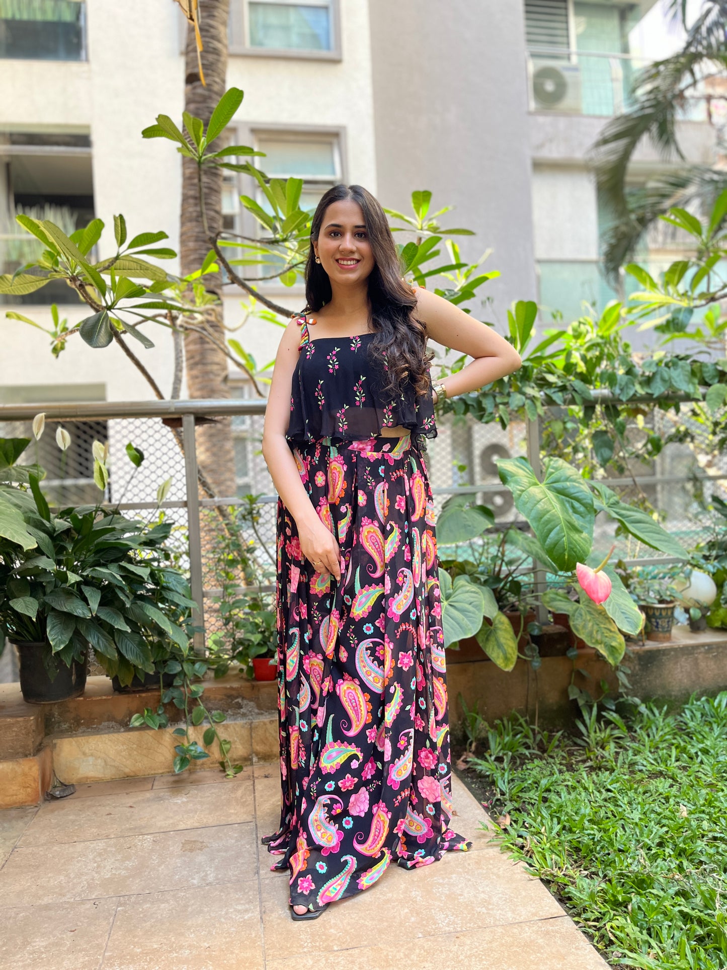 Black floral printed cami with colorful mirror work detailing with paisley printed high waisted palazzo pants