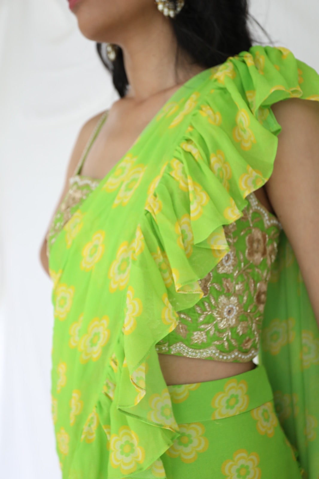 Lime green pre stitched ruffle sari with a hand embroidered blouse