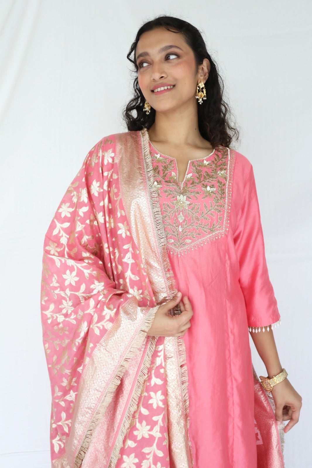 Peachy pink kurta set with a hand embroidered yoke and handwoven dupatta