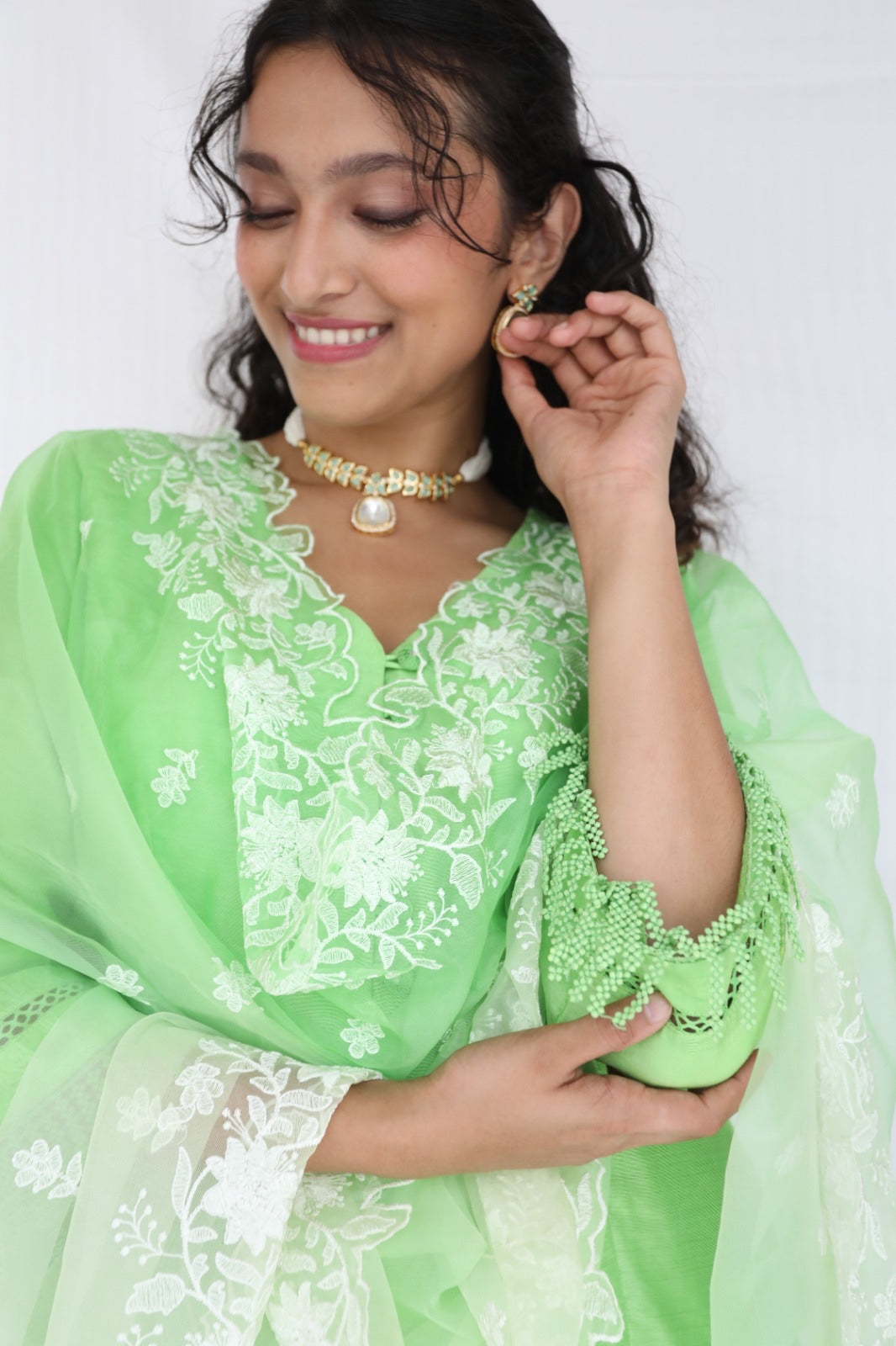 Mint green chanderi kurta set with intricate lace and shell detailing with an ombré dyed organza cutwork dupatta