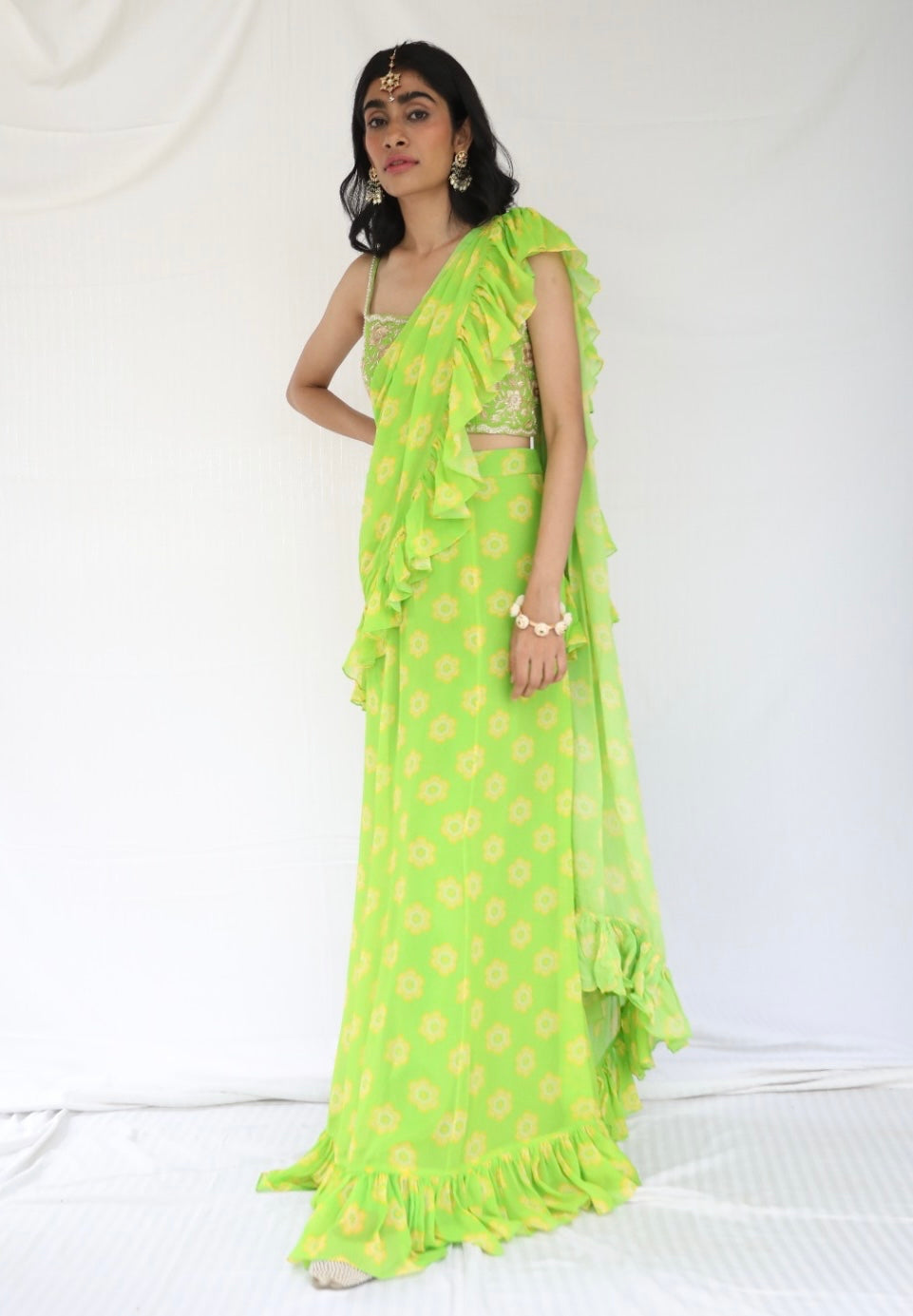 Lime green pre stitched ruffle sari with a hand embroidered blouse