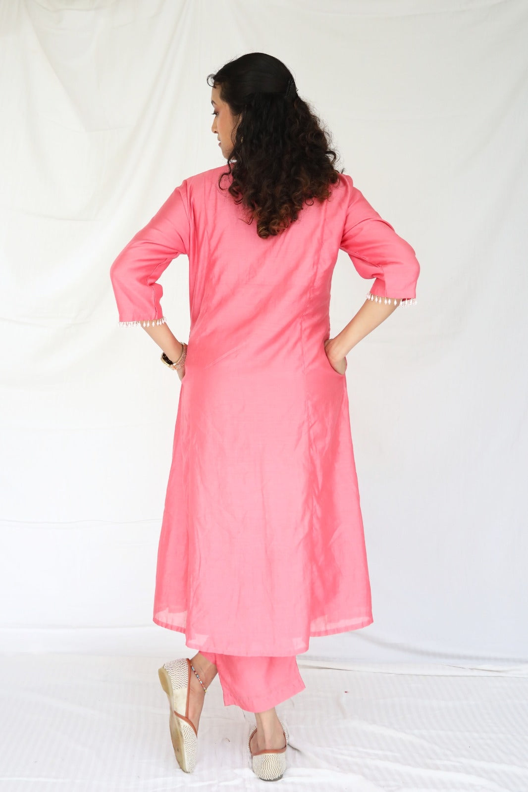 Peachy pink kurta set with a hand embroidered yoke and handwoven dupatta