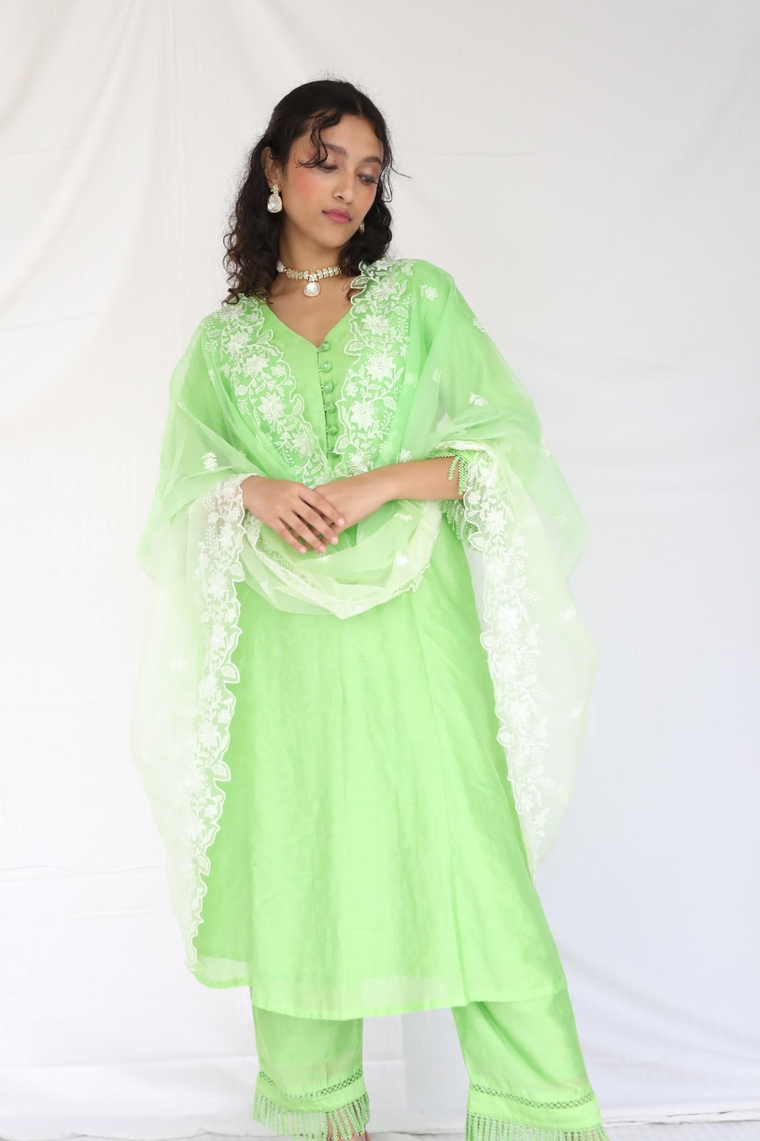 Mint green chanderi kurta set with intricate lace and shell detailing with an ombré dyed organza cutwork dupatta