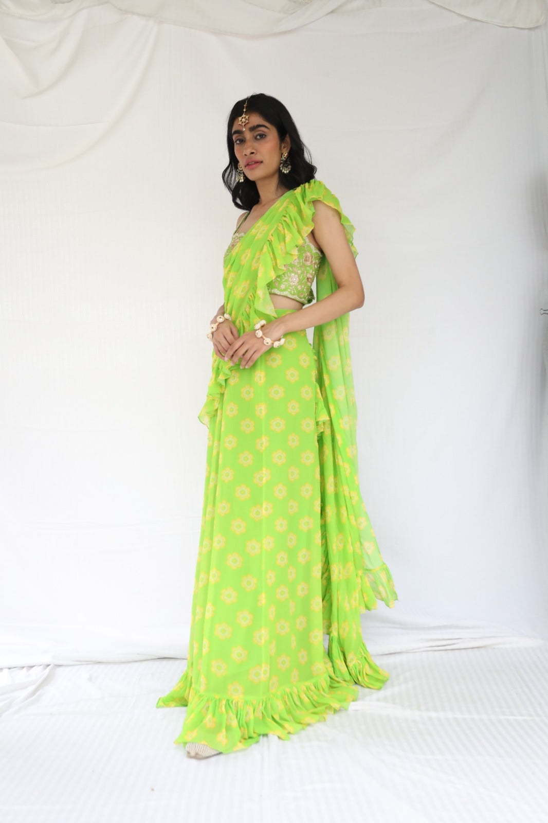 Lime green pre stitched ruffle sari with a hand embroidered blouse