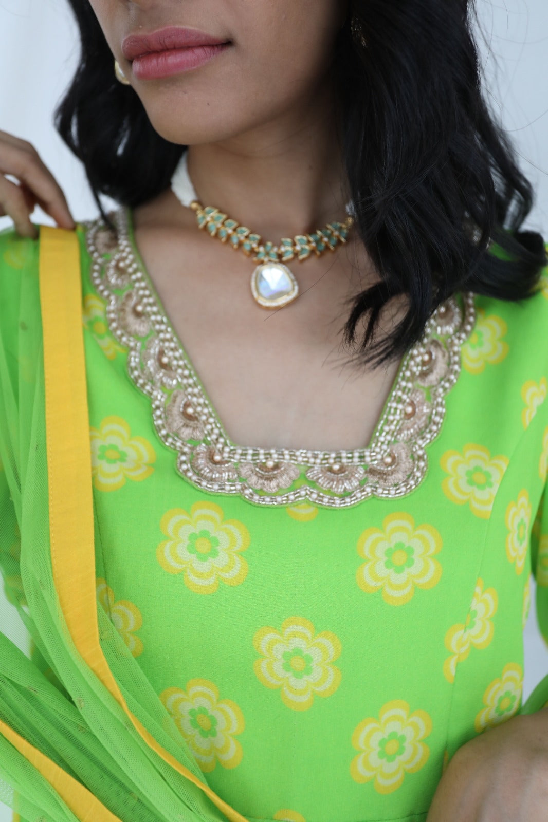 Green yellow floral printed sharara set with a hand embroidered neckline and dupatta