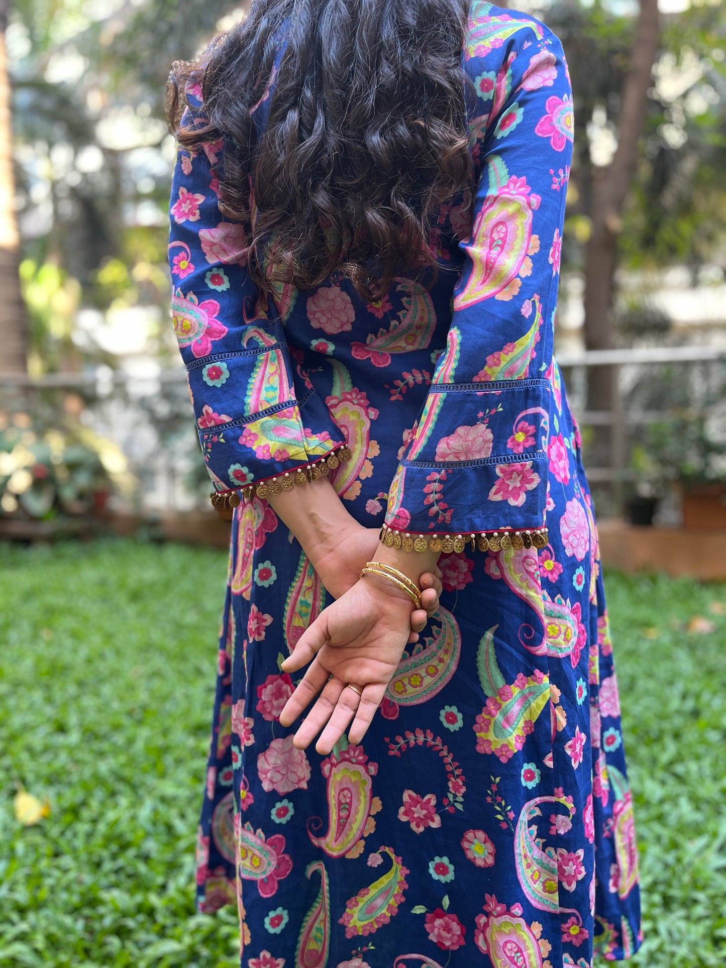 Navy blue paisley printed kurta with gold coin detailing, floral printed organza dupatta and pyjama pants