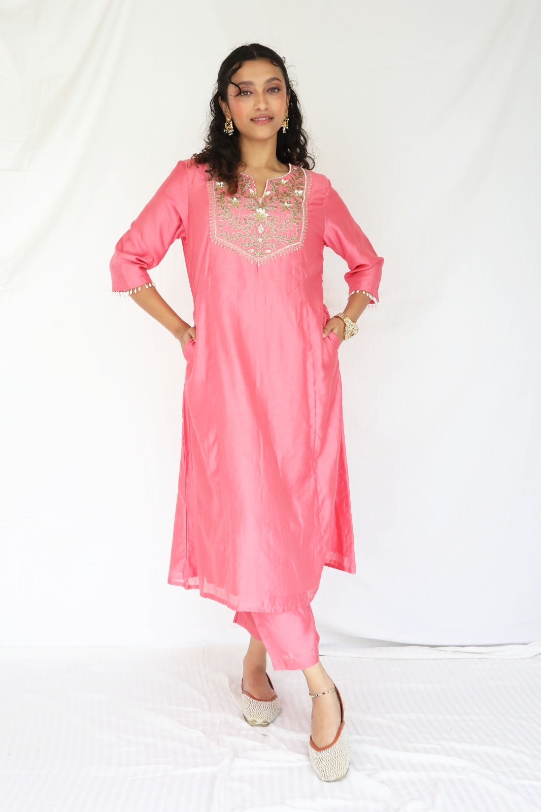 Peachy pink kurta set with a hand embroidered yoke and handwoven dupatta