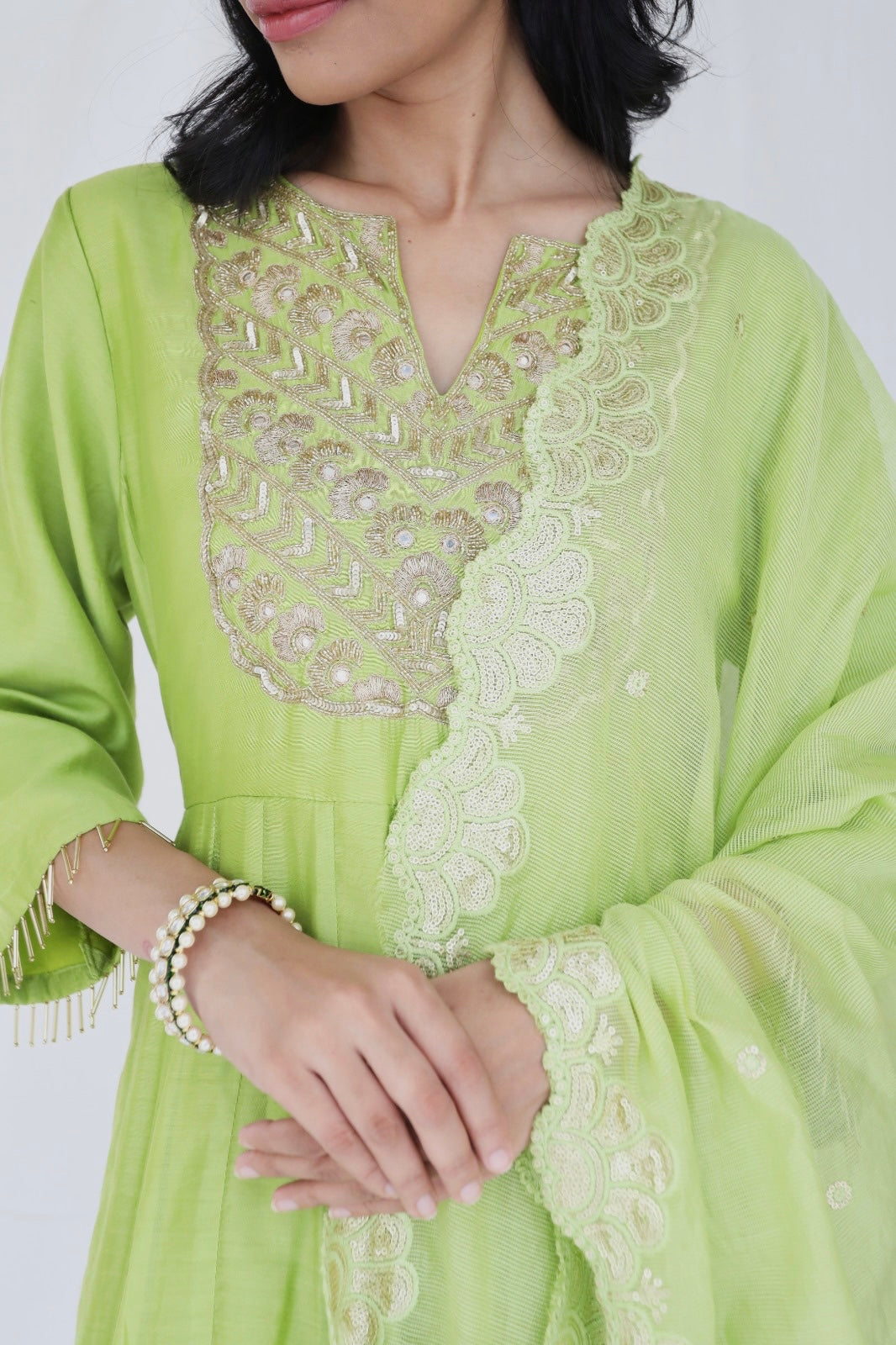 Dusty green chanderi anarkali with a hand embroidered yoke and embellished dupatta