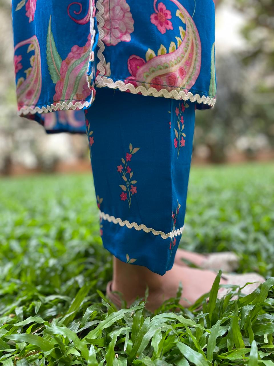 Peacock blue paisley printed kurta and floral printed pyjama pants with intricate lace detailing