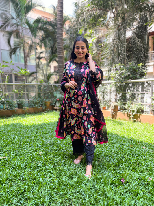 Black paisley printed kurta with a floral printed organza dupatta and pyjama pants