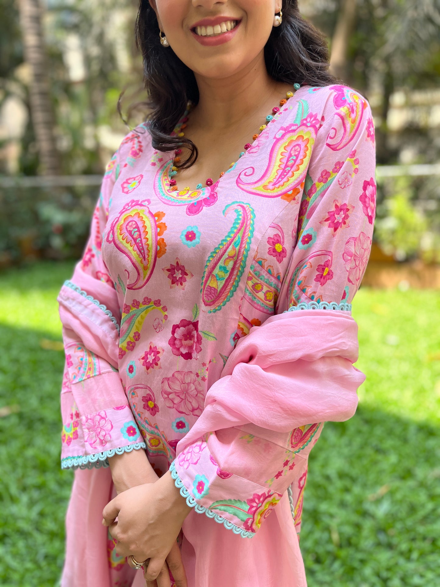 Baby pink paisley printed kurta with colorful mirror detailing, pyjama pants and an organza dupatta