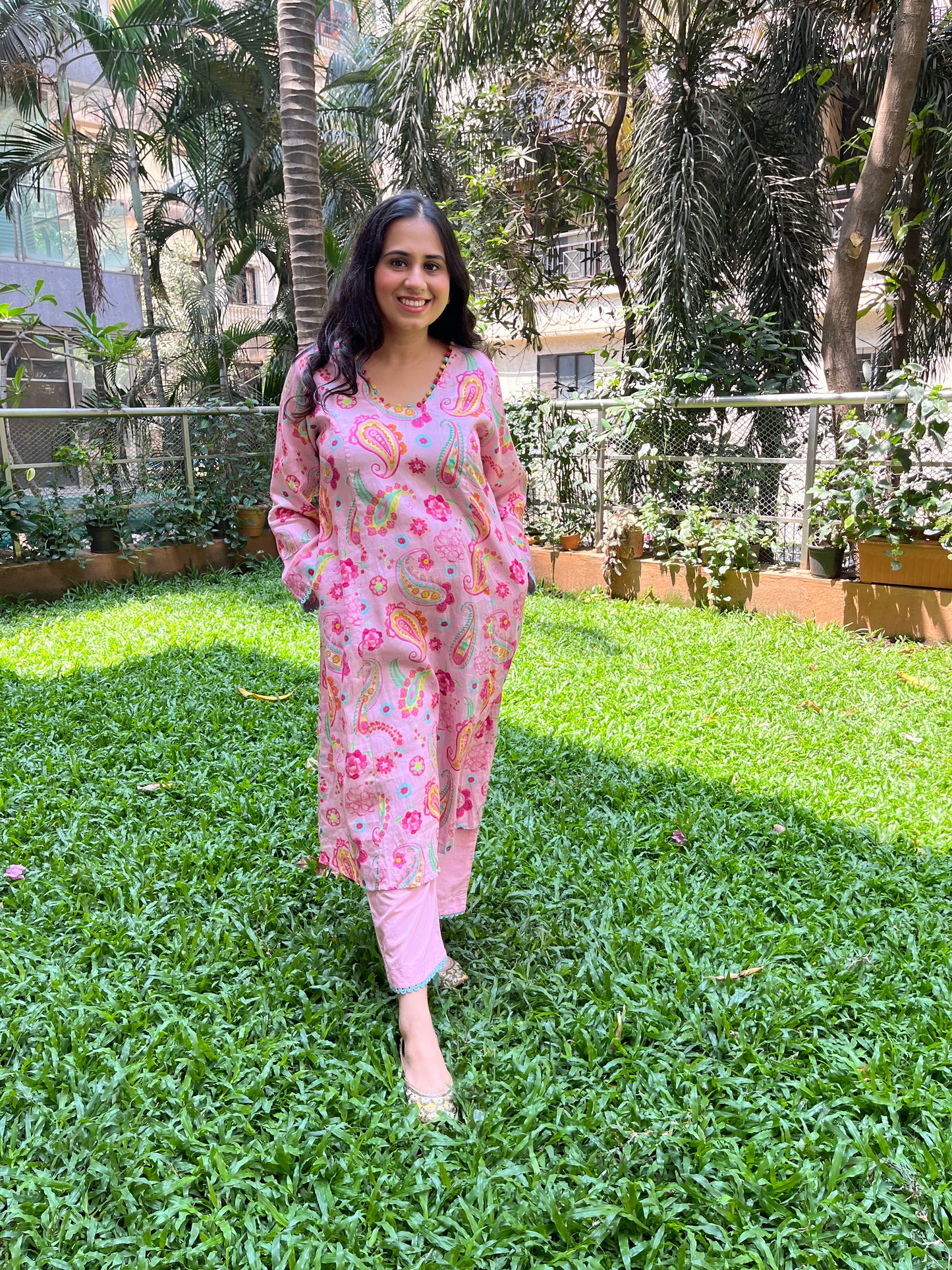 Baby pink paisley printed kurta with colorful mirror detailing, pyjama pants and an organza dupatta