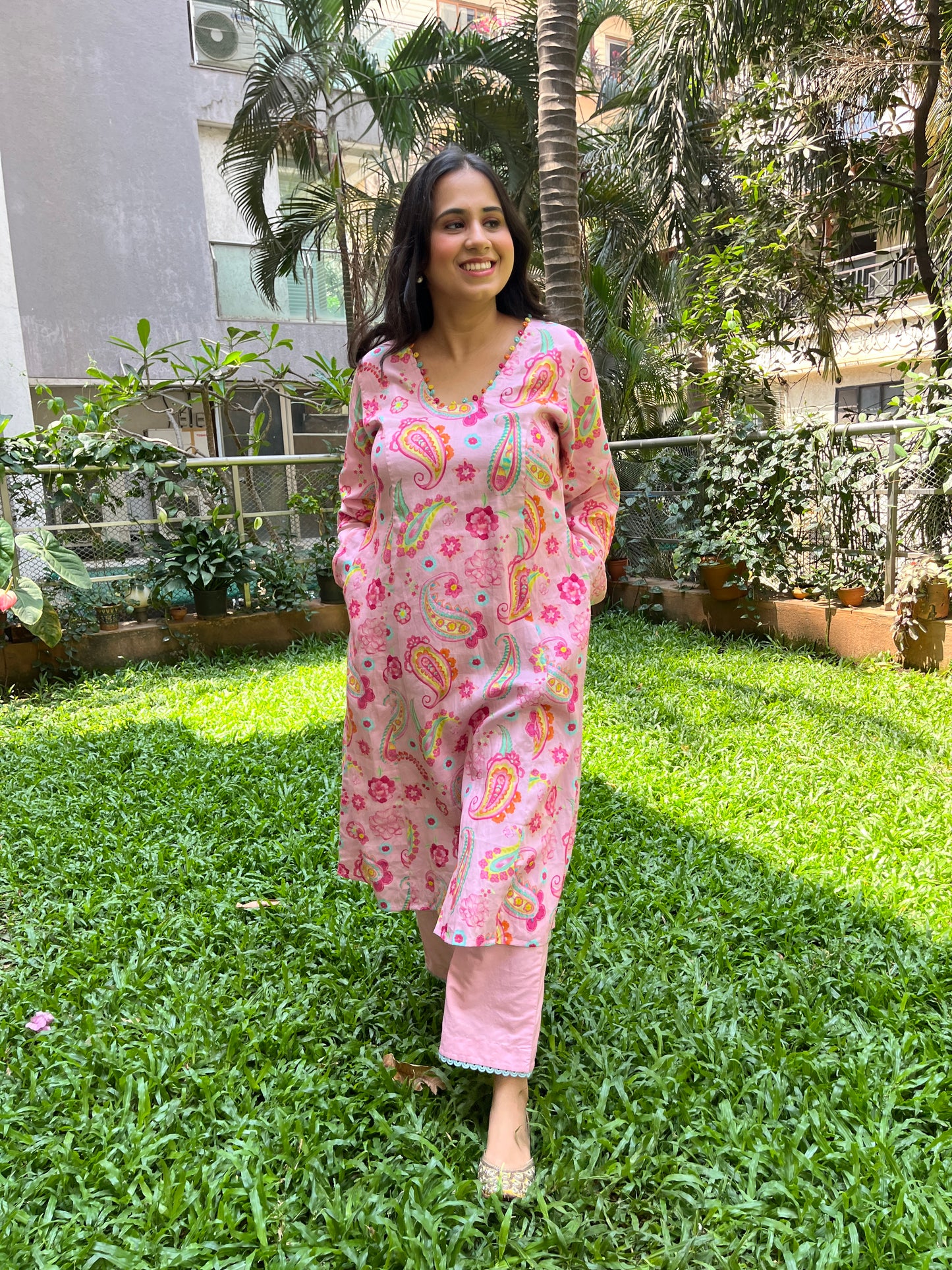 Baby pink paisley printed kurta with colorful mirror detailing, pyjama pants and an organza dupatta