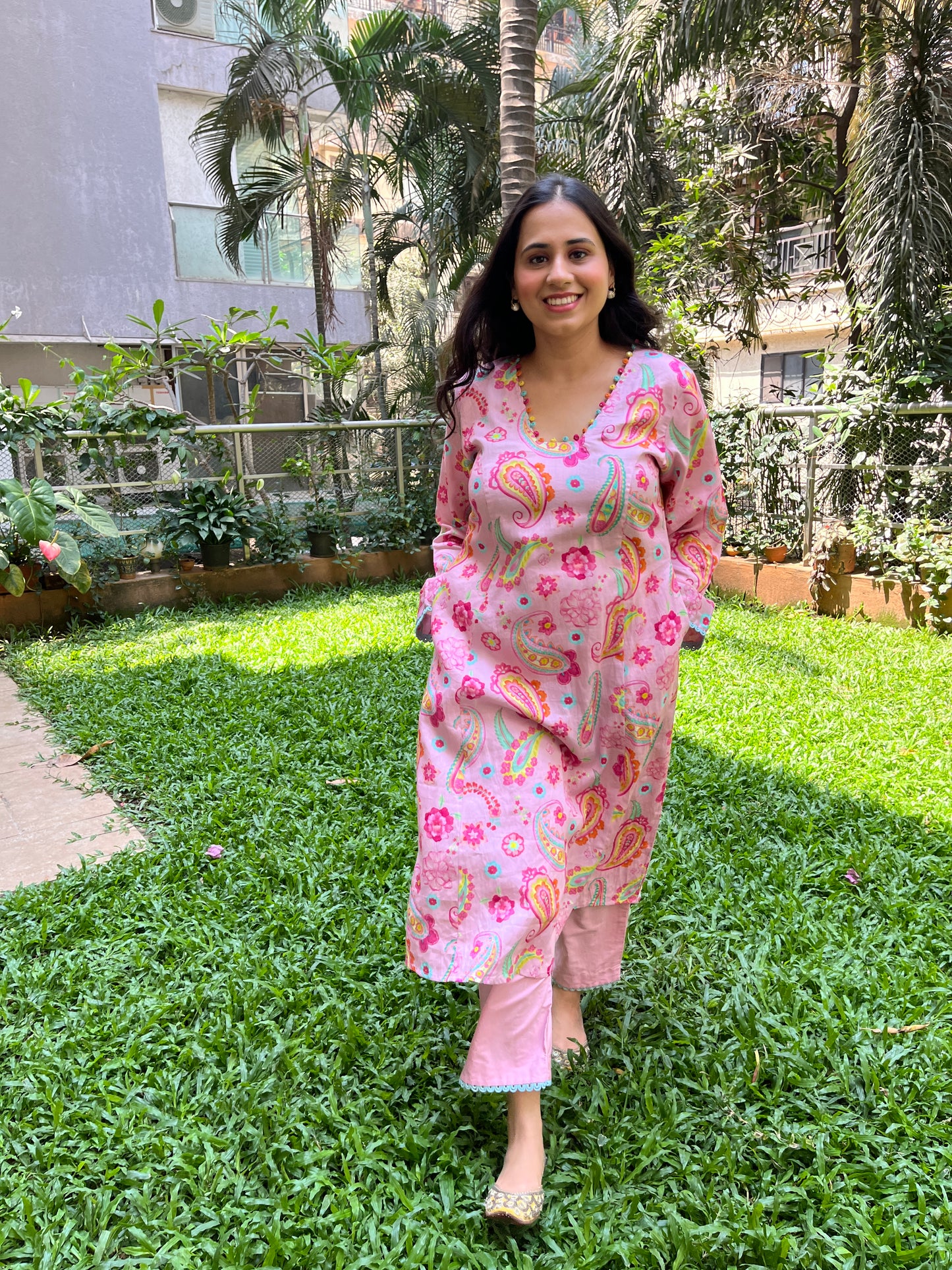 Baby pink paisley printed kurta with colorful mirror detailing, pyjama pants and an organza dupatta