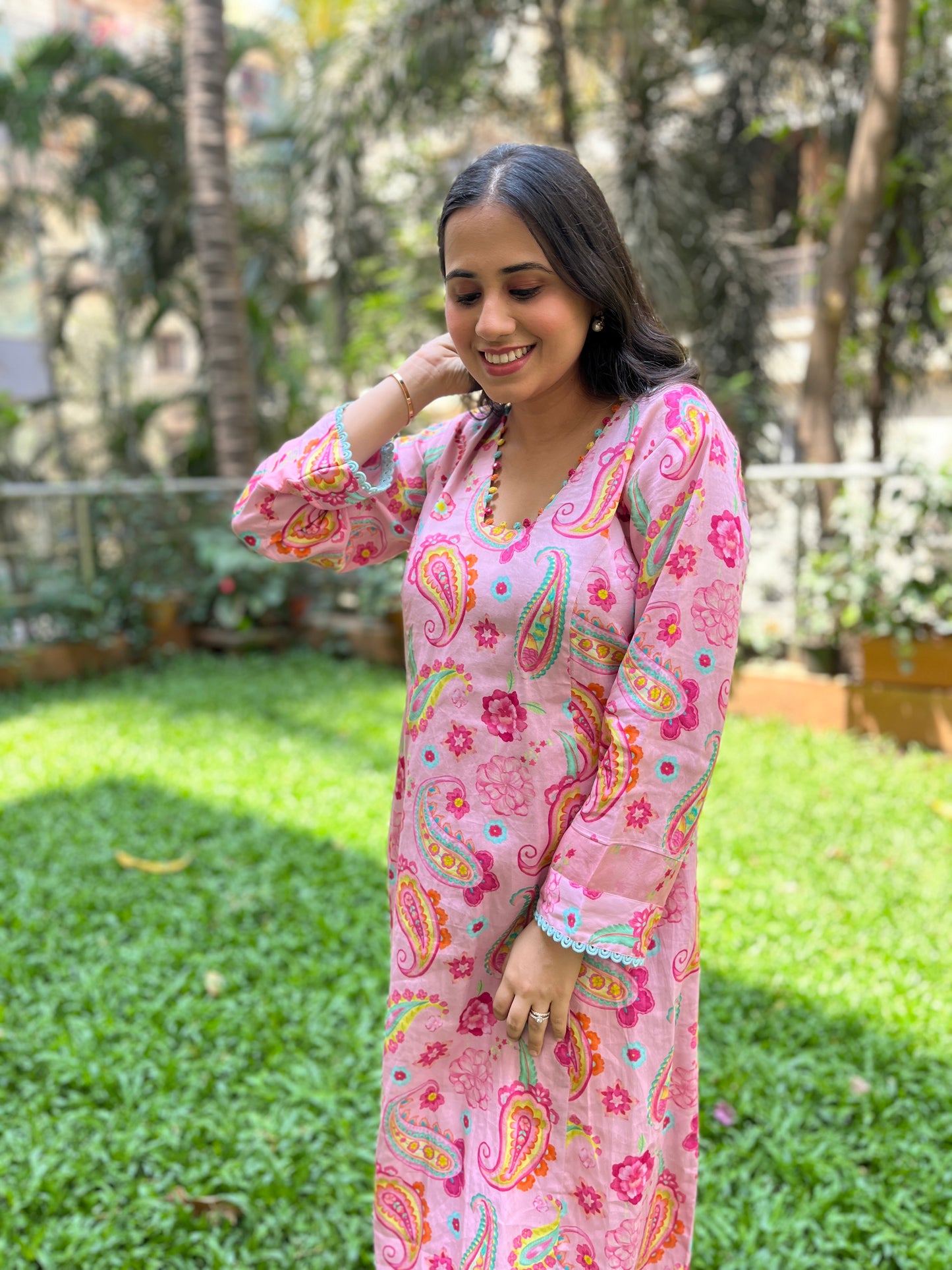 Baby pink paisley printed kurta with colorful mirror detailing, pyjama pants and an organza dupatta