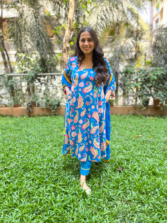 Peacock blue paisley printed kurta with tassel detailing, floral printed organza dupatta and pyjama pants