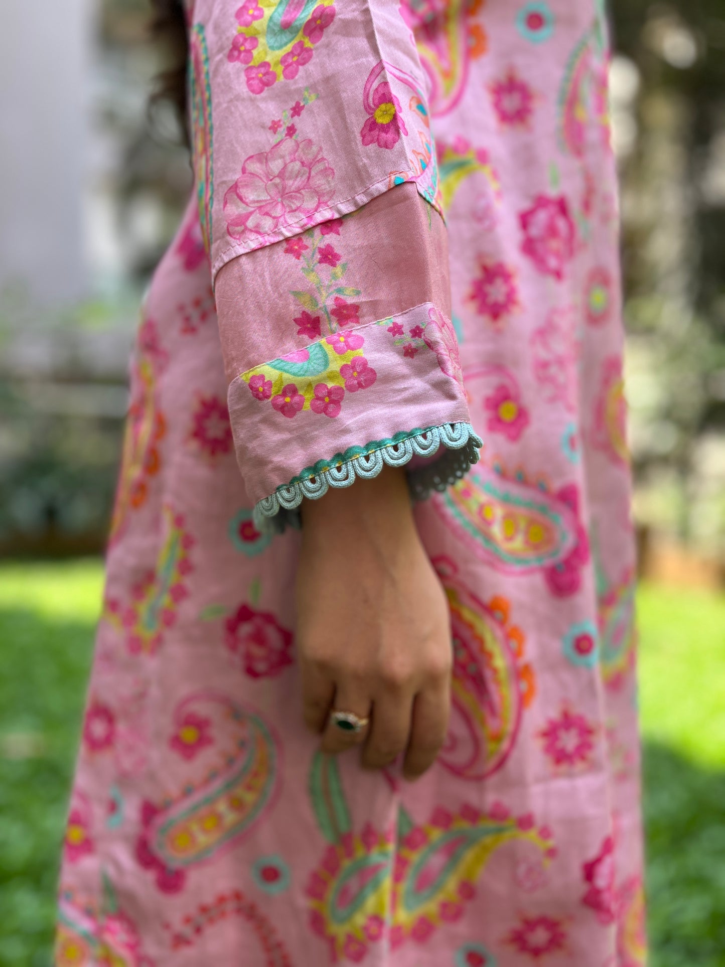 Baby pink paisley printed kurta with colorful mirror detailing, pyjama pants and an organza dupatta