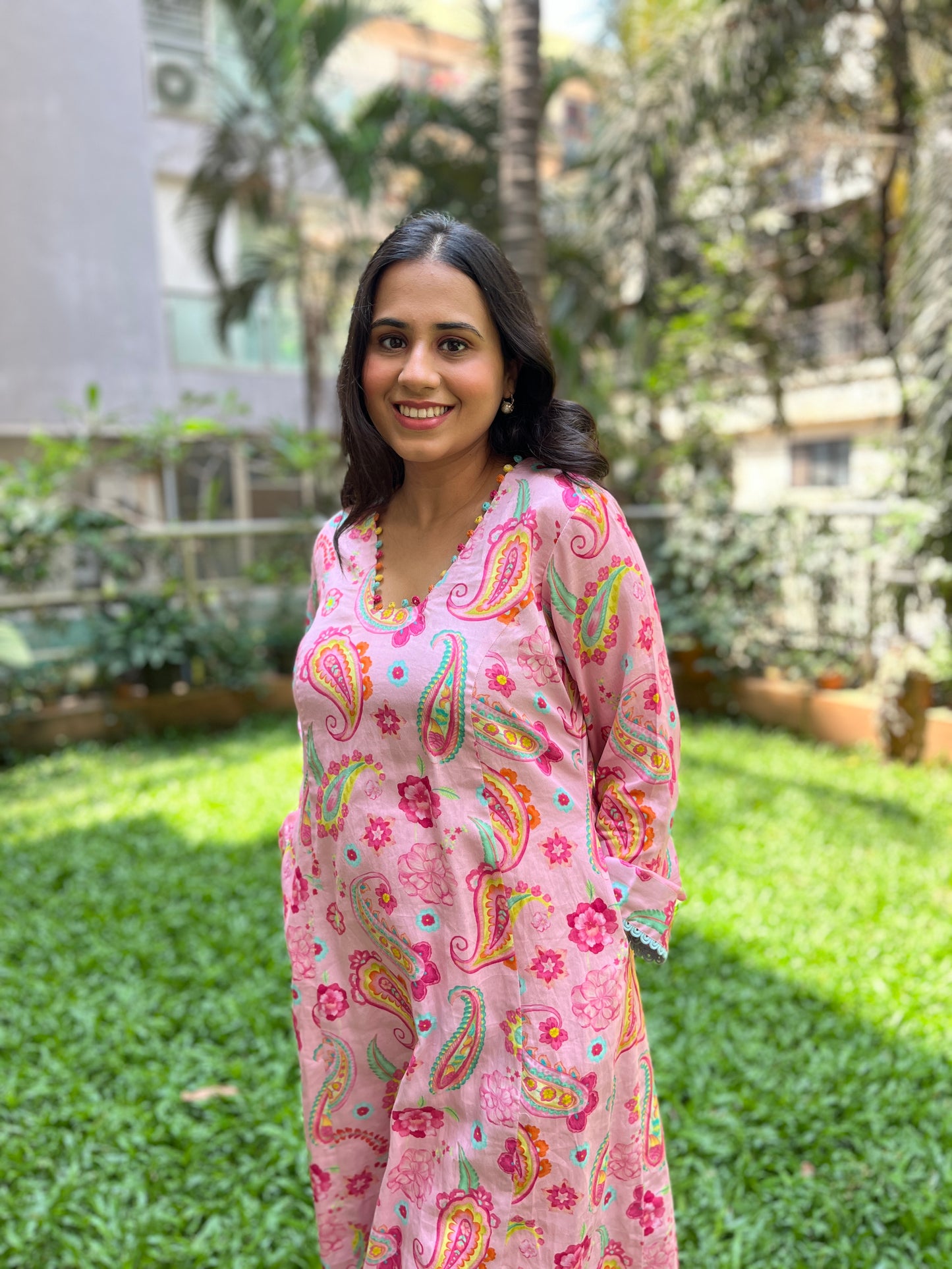 Baby pink paisley printed kurta with colorful mirror detailing, pyjama pants and an organza dupatta