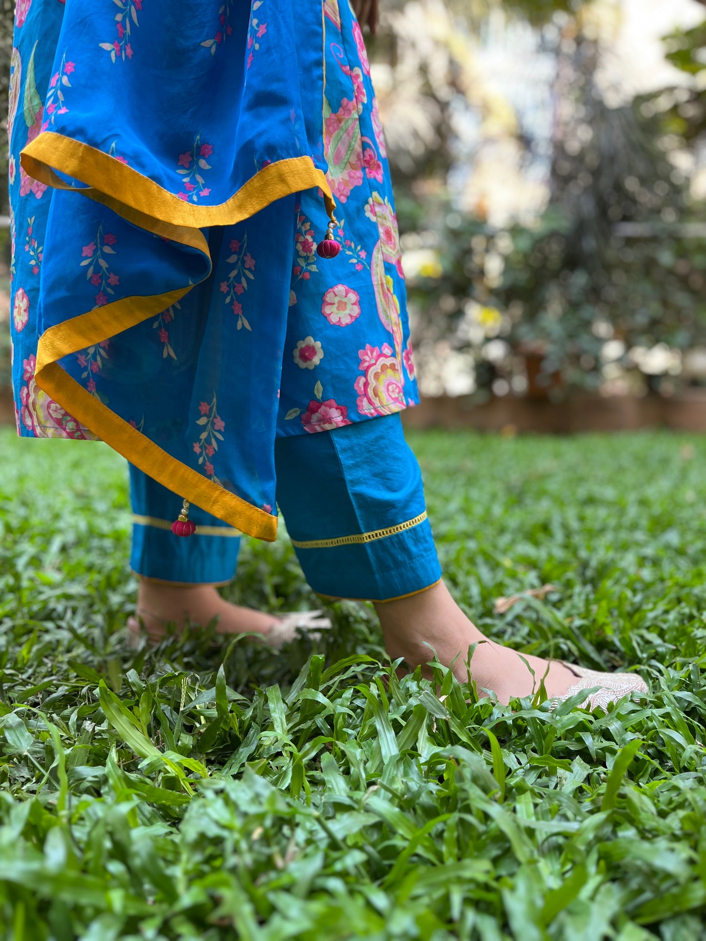 Peacock blue paisley printed kurta with tassel detailing, floral printed organza dupatta and pyjama pants