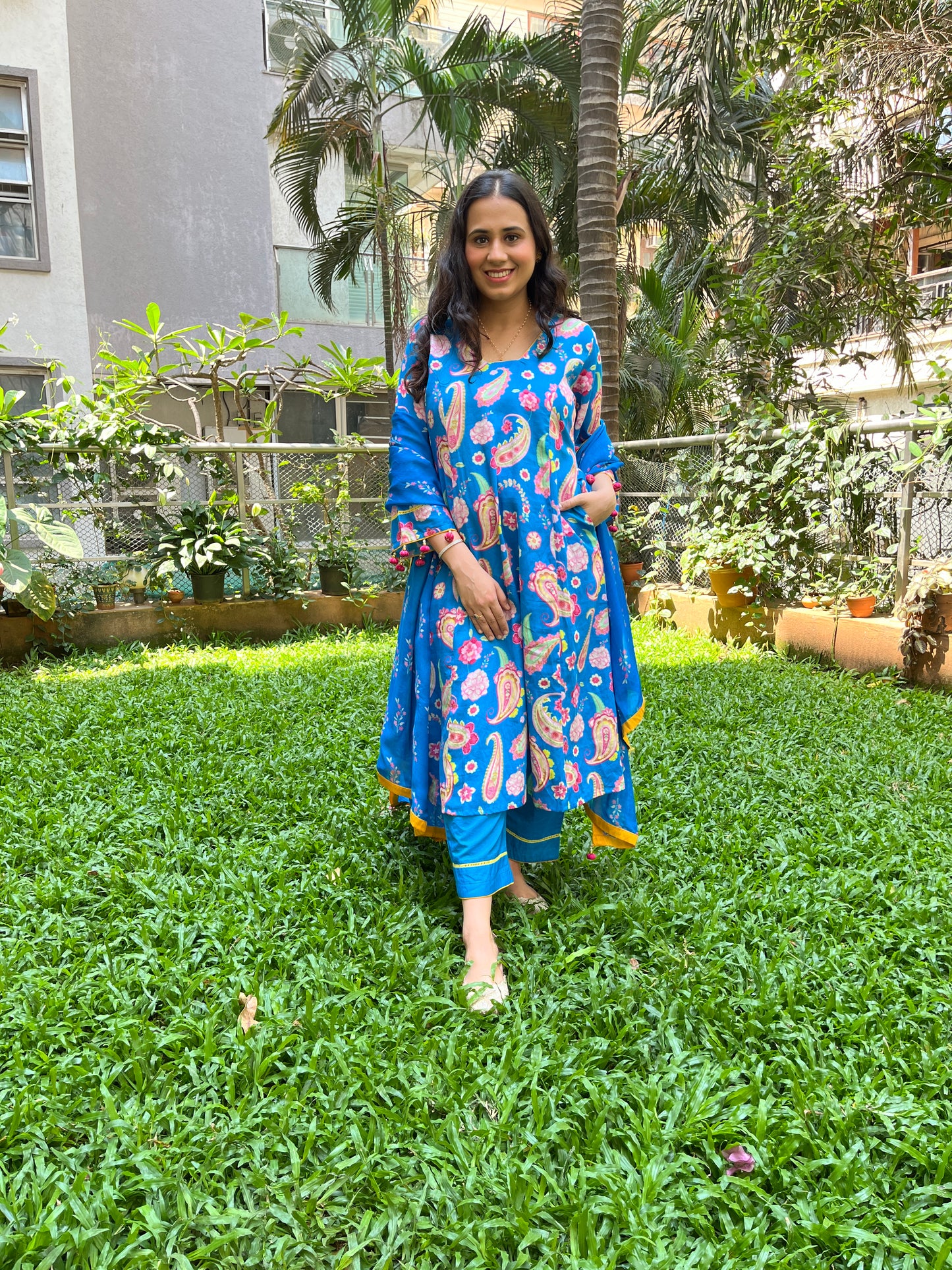 Peacock blue paisley printed kurta with tassel detailing, floral printed organza dupatta and pyjama pants