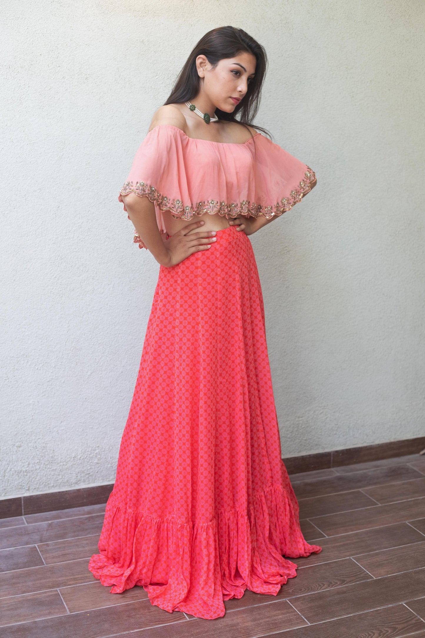 Baby pink off shoulder crop with a high waisted geometric floral printed skirt