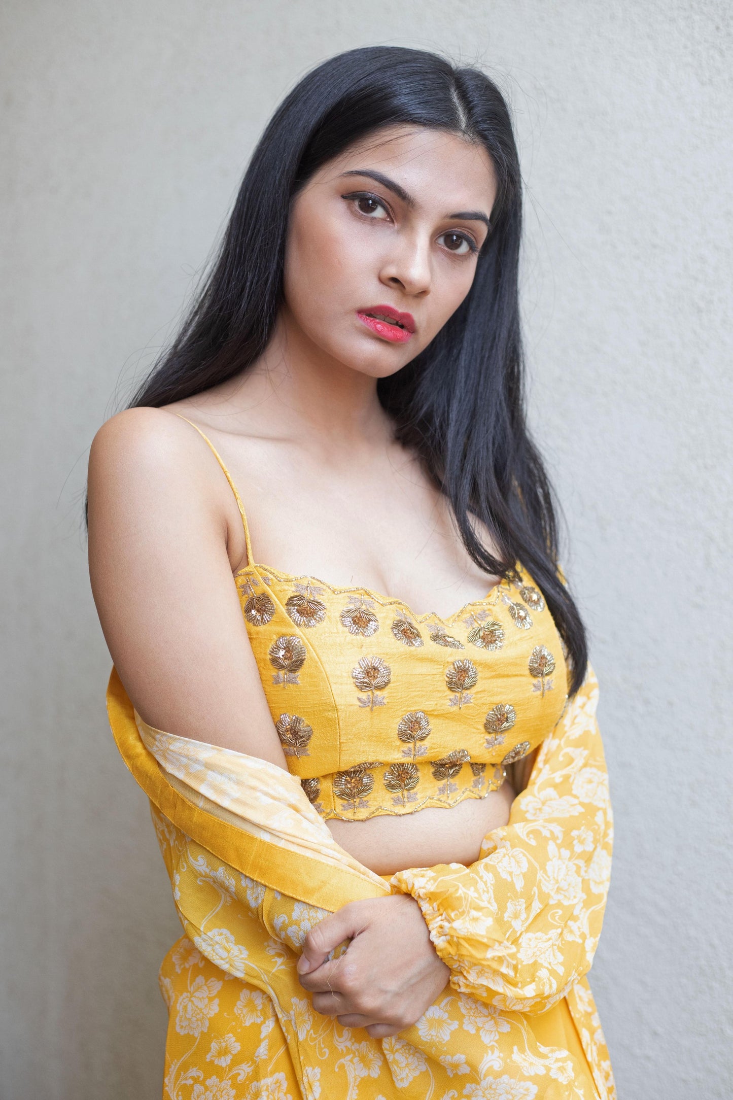 Hand embroidered yellow blouse with a straight pant and ruffle cape