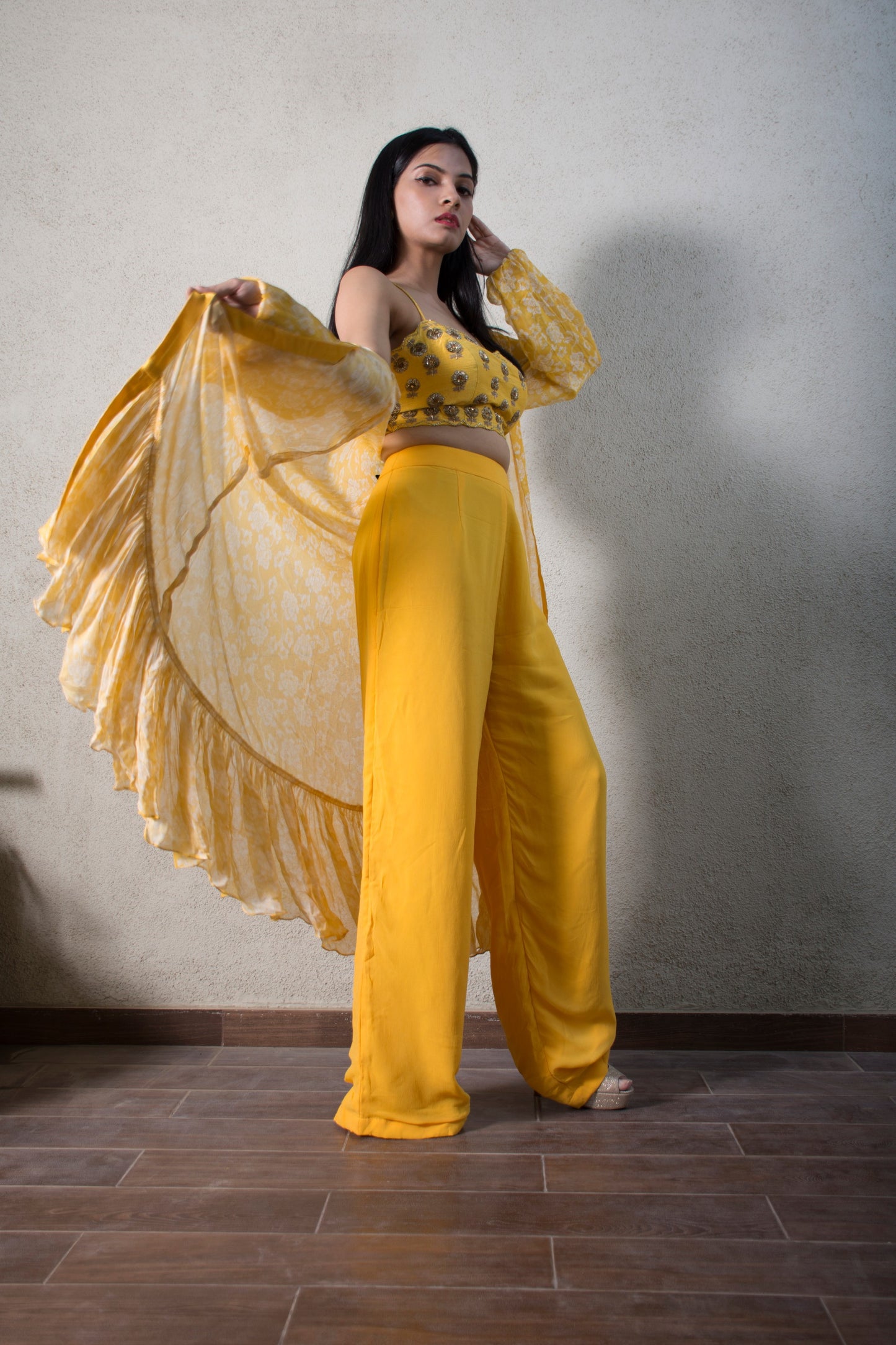 Hand embroidered yellow blouse with a straight pant and ruffle cape