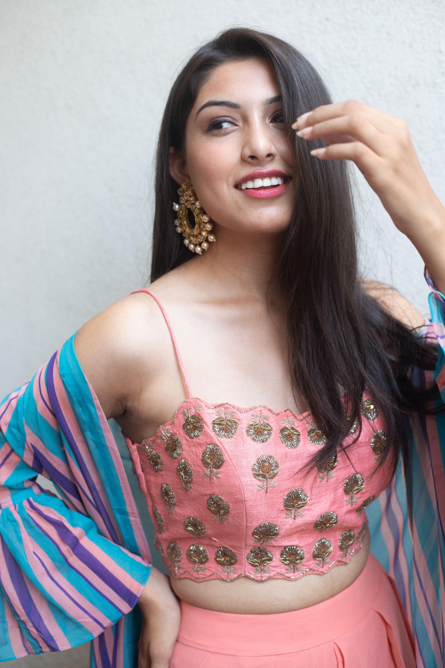 Hand embroidered pink blouse and palazzos with a stripe ruffle cape