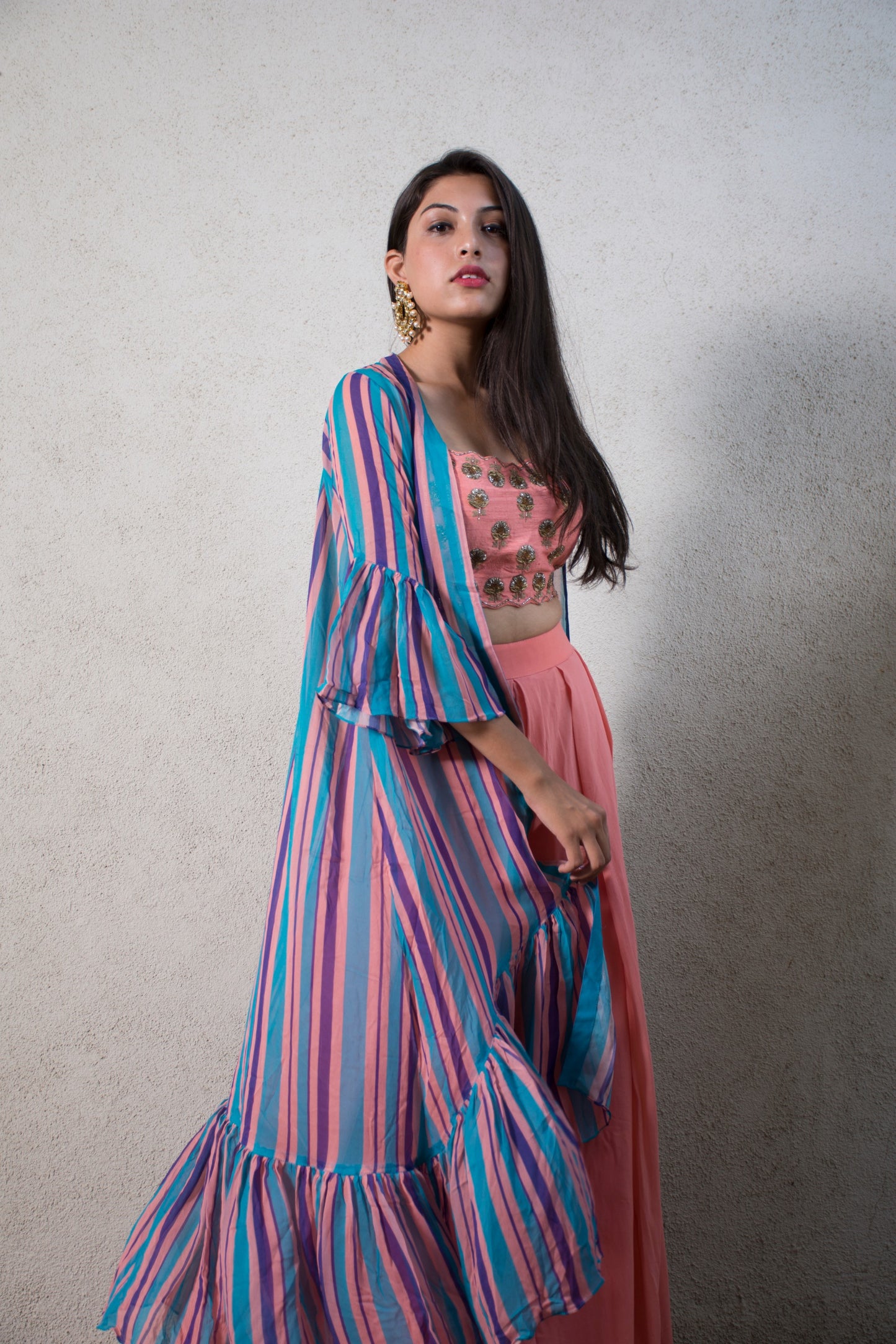 Hand embroidered pink blouse and palazzos with a stripe ruffle cape