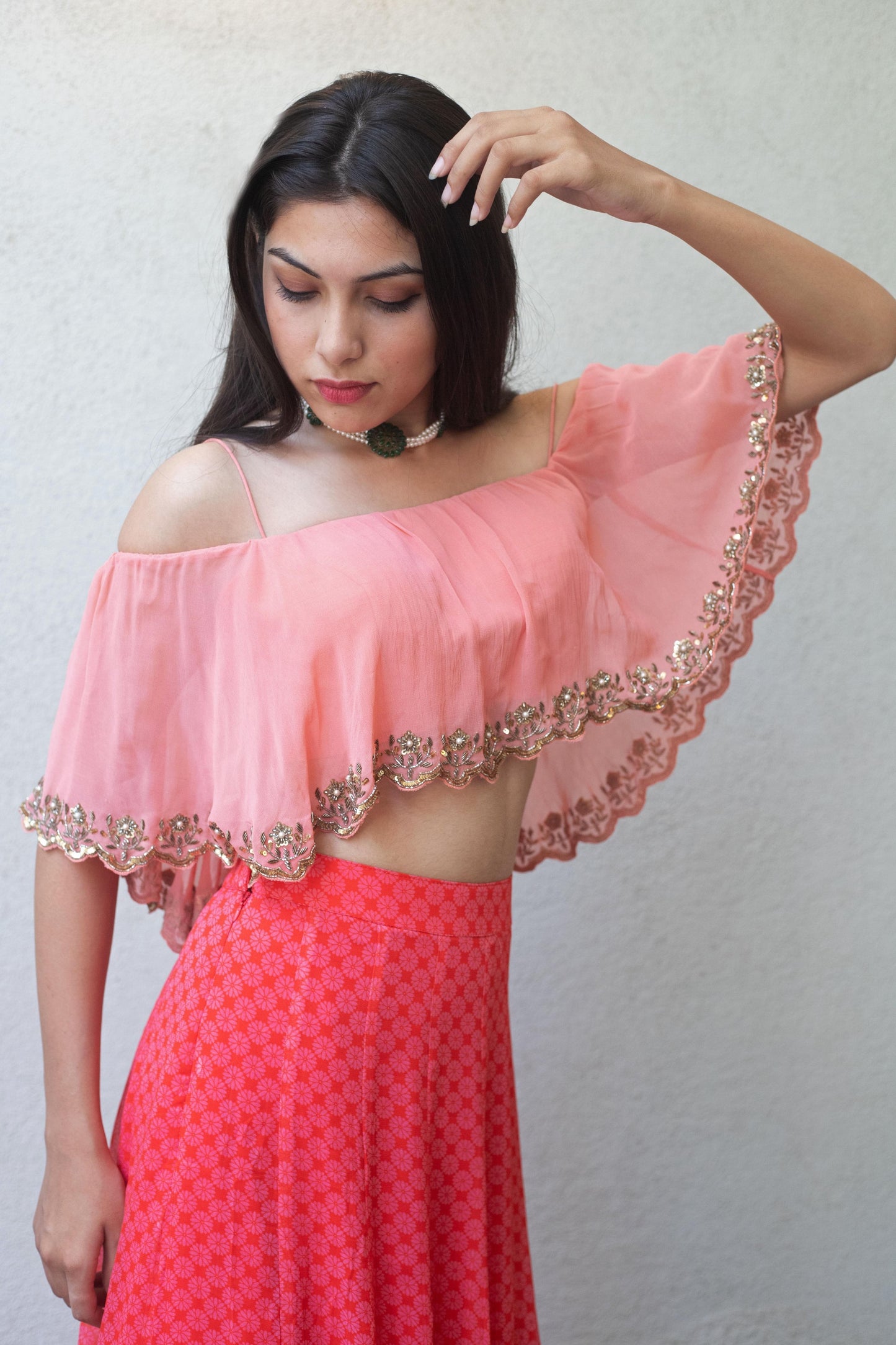 Baby pink off shoulder crop with a high waisted geometric floral printed skirt