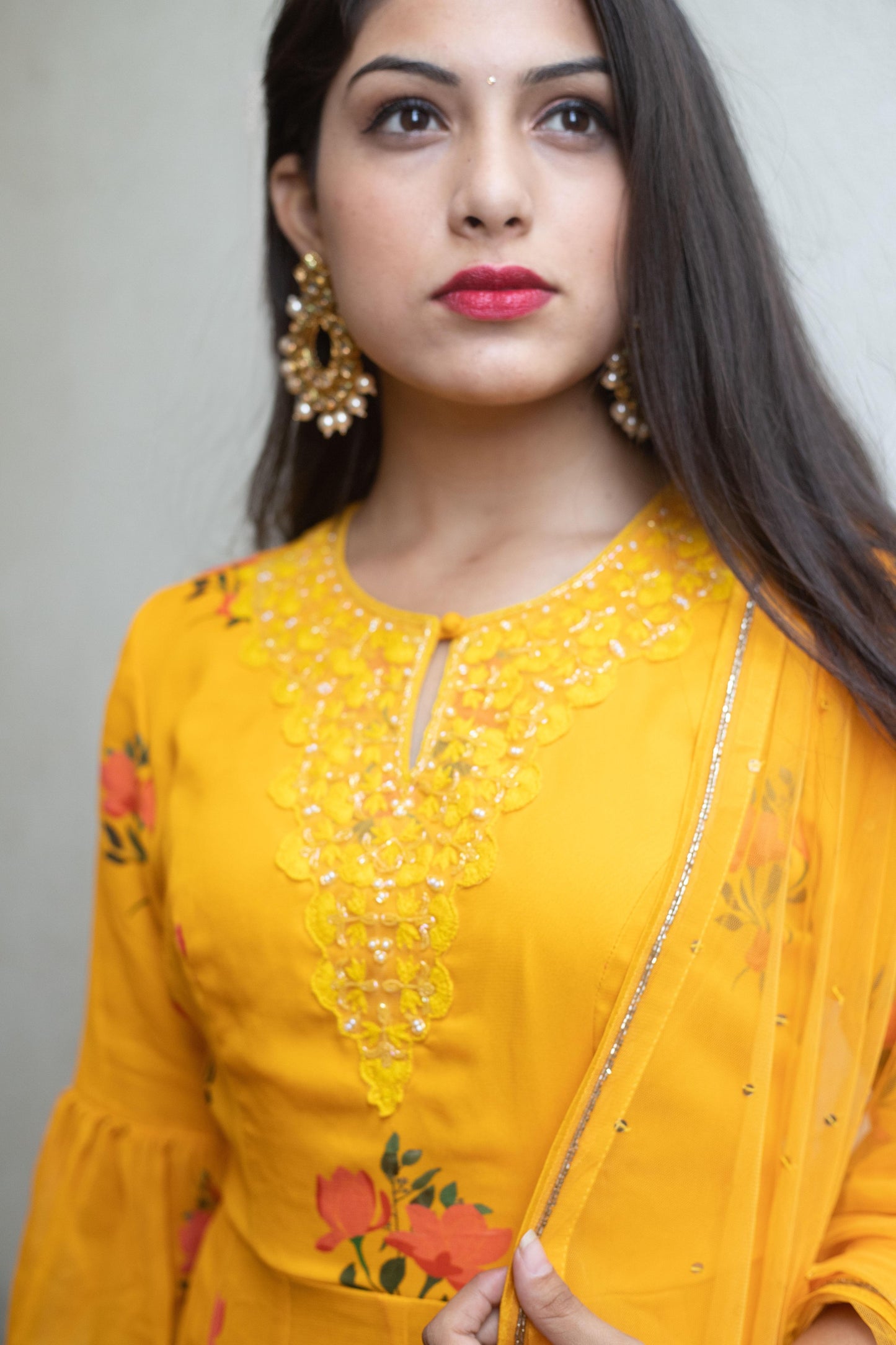 Mustard yellow floral ruffle anarkali with a hand embroidered yoke and dupatta