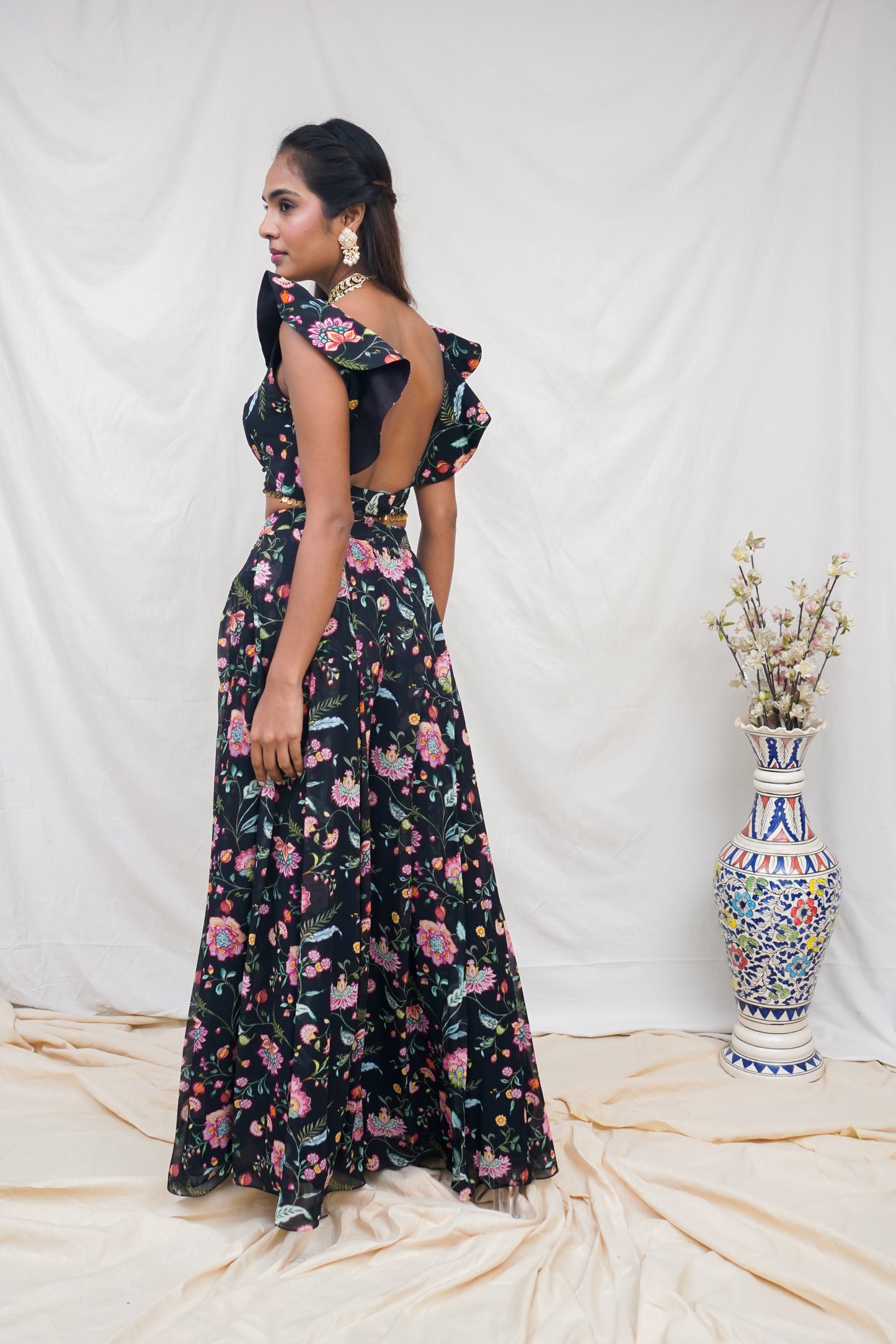 Black floral printed ruffle crop top with an embellished hem and high waisted palazzo pants