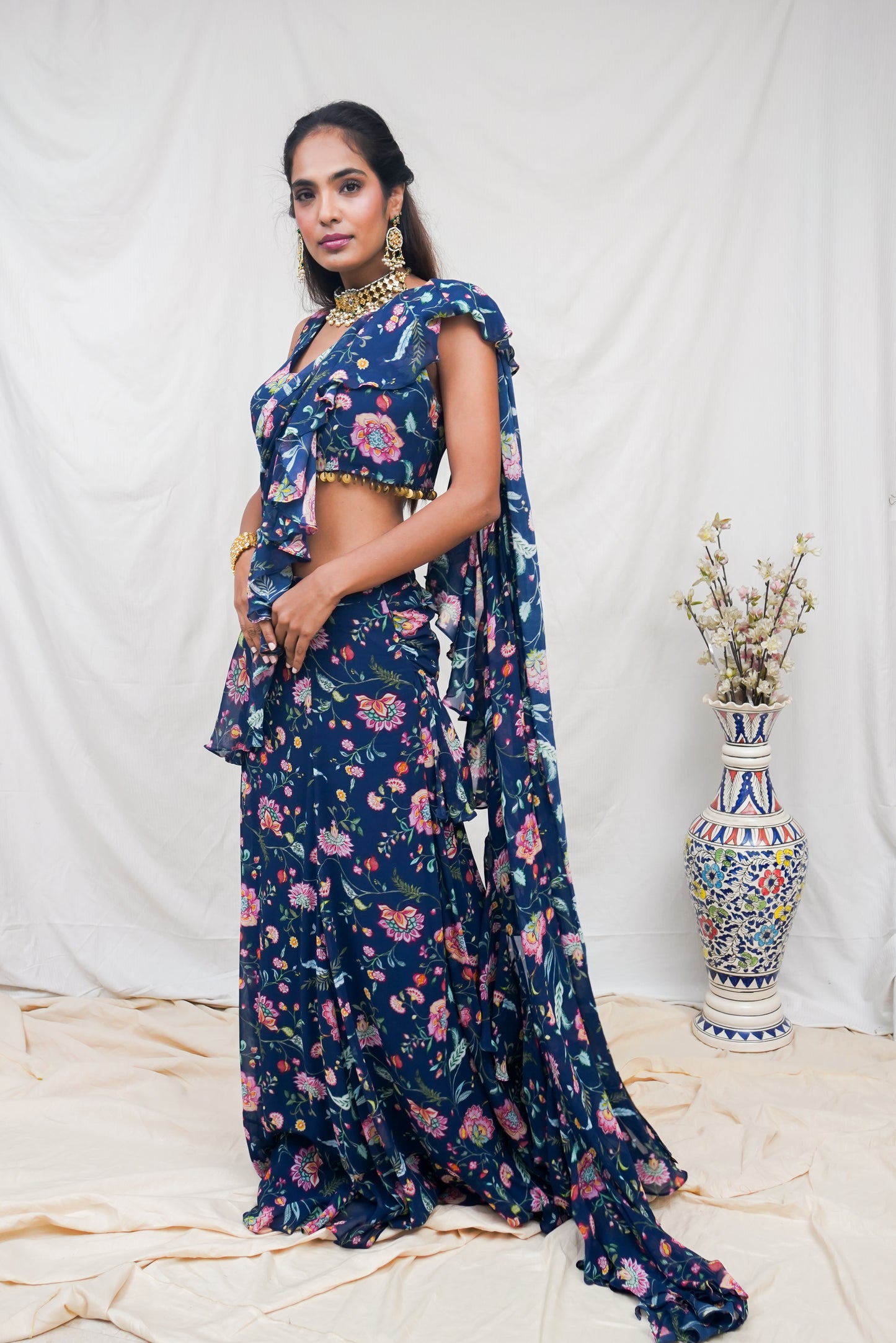 Navy blue pre pleated sari and printed blouse with an embellished hem