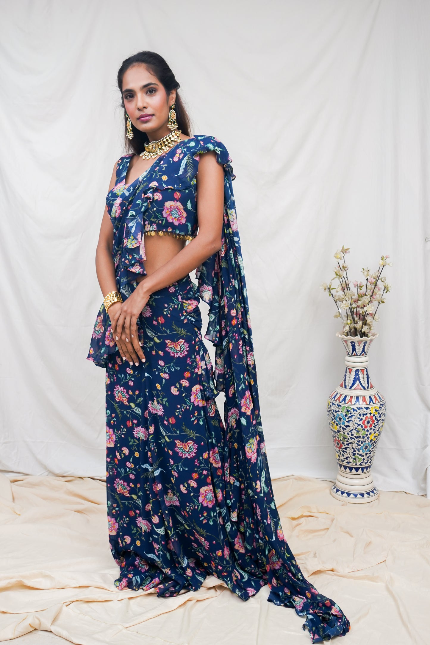 Navy blue pre pleated sari and printed blouse with an embellished hem