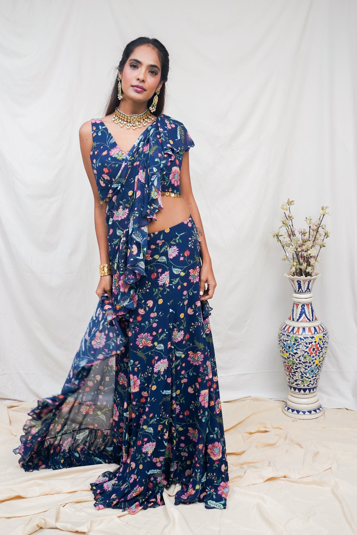 Navy blue pre pleated sari and printed blouse with an embellished hem